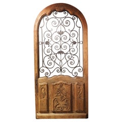 Early 1900s Arched Oak and Iron Entry Door from France