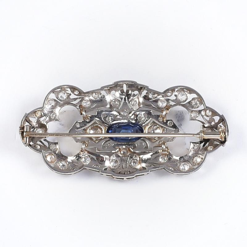 Handmade Art deco brooch from the early 1900's in 18k white gold with 1 sapphire 1.5 carats circa and 46 old cut diamonds 2 carats circa.