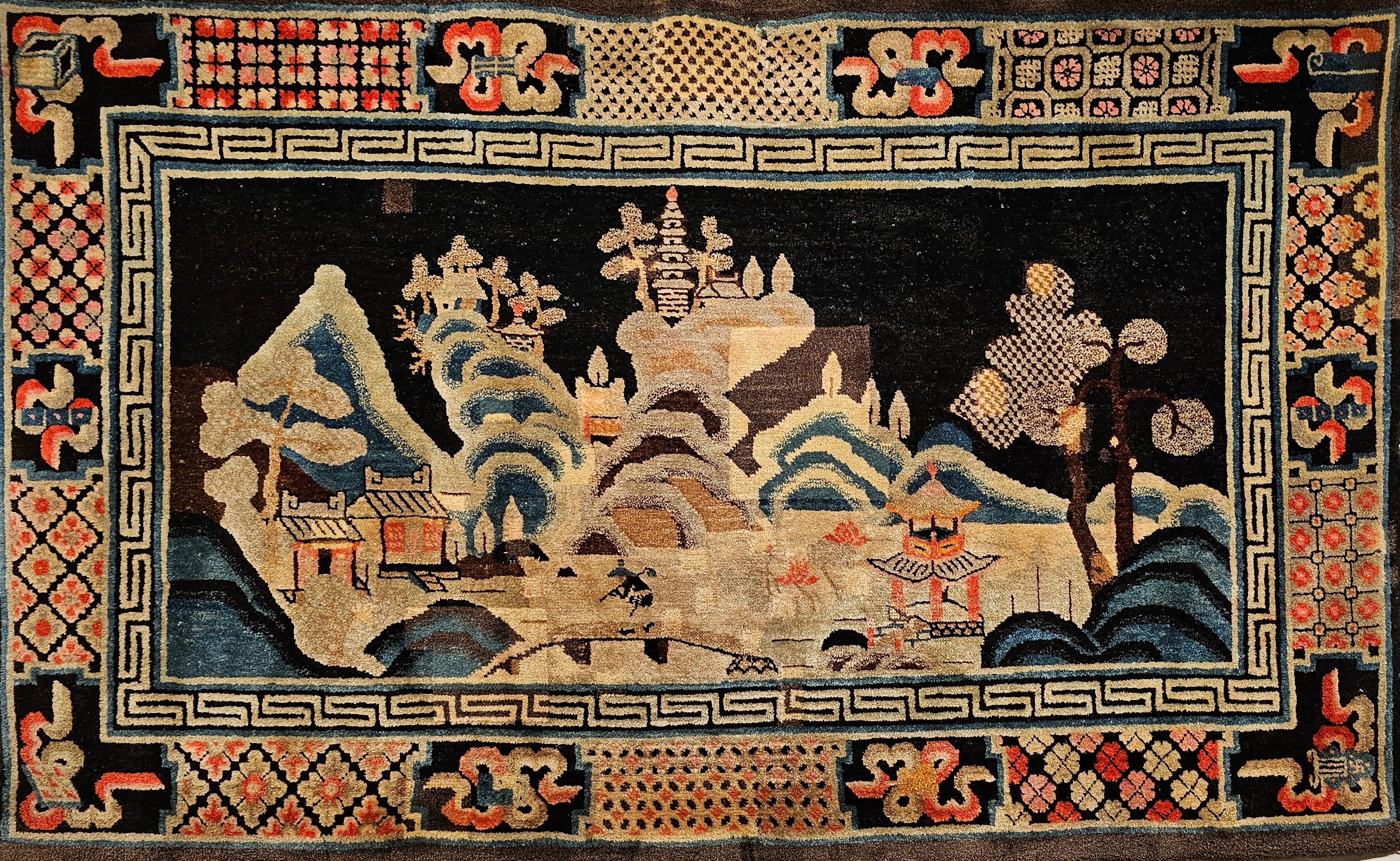 A beautiful late 19th century Ningxia  rug from the western China.  The rug has a design similar to the Khotan and Ningxia rugs.  The design is of countryside with mountains in the distance with pagodas on top and rivers in the valley.  There is a