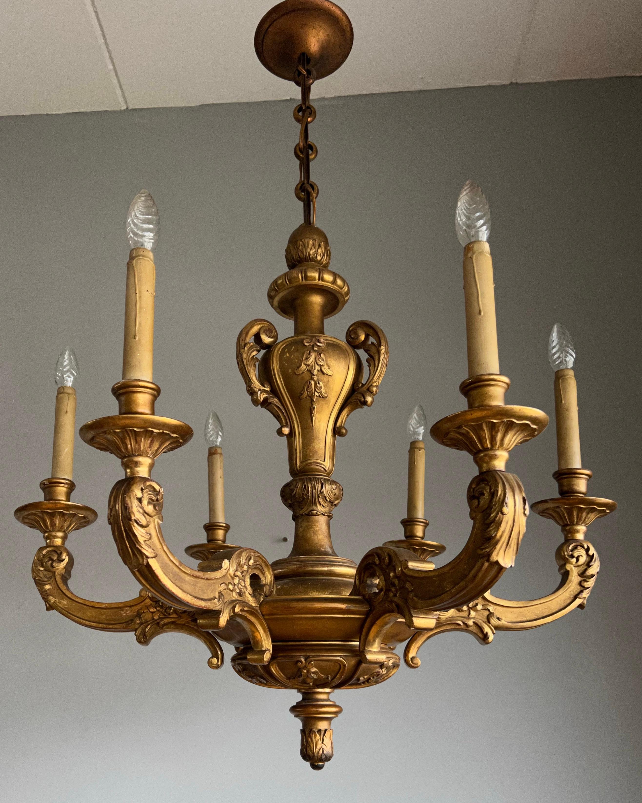 Beautiful and all handcrafted chandelier from the turn of the century. 

This good quality and practical size, hundred years old pendant has six perfectly and evenly carved arms. This turn of the century workmanship pendant is made of solid wood and