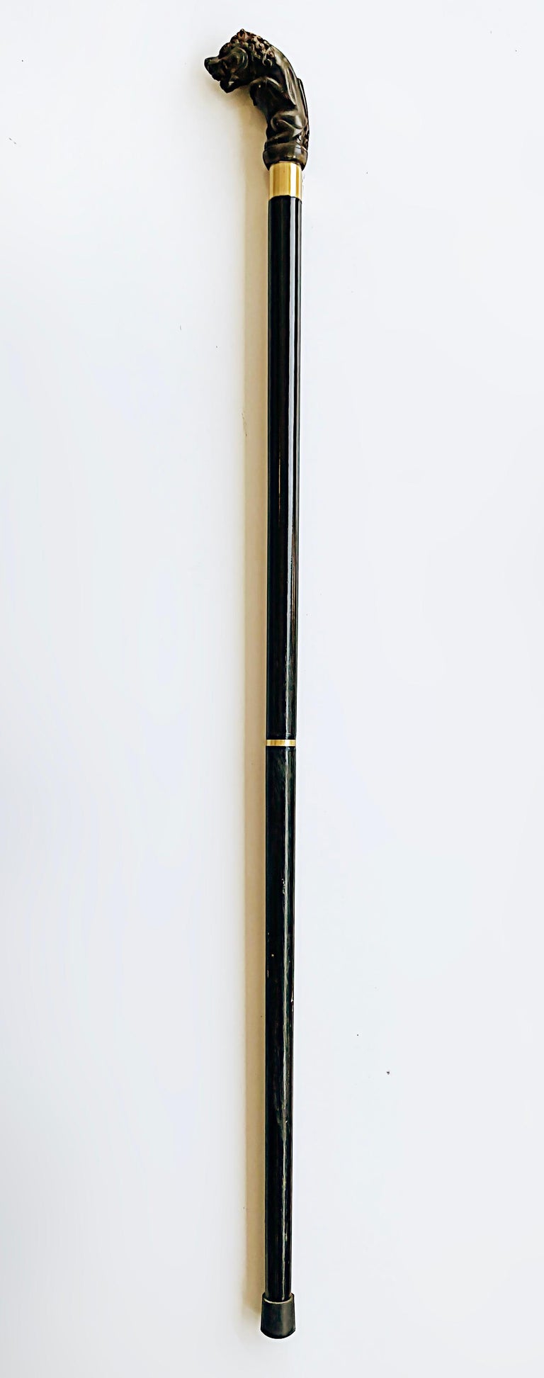 Early 1900s Asian Carved Horn Foo Dog Walking Stick with Metal Bands