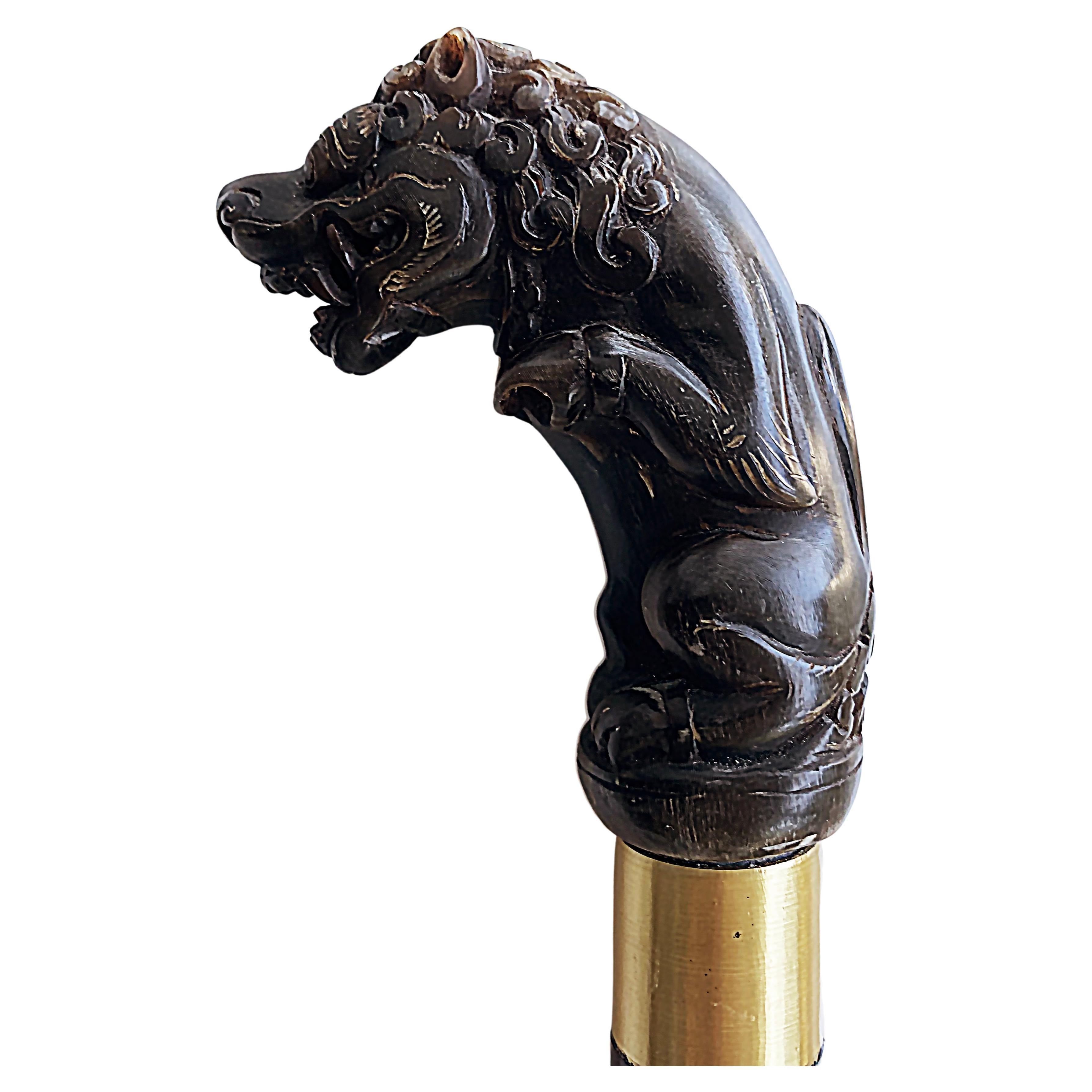 Early 1900s Asian Carved Horn Foo Dog Walking Stick with Metal Bands