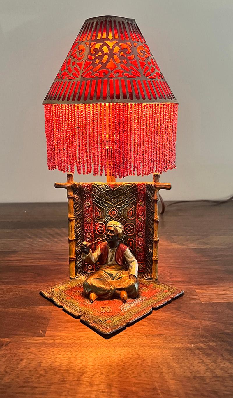Very cool early 1900s Austrian cold painted figural lamp. These were either made of bronze or spelter and were often painted as the metal was cooling creating a an enamel like finish. Casting details are very fine and original paint is very vibrant.
