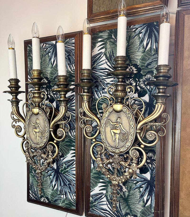 Make a statement with this incredible pair of cast bronze beaux arts candelabra wall sconces. Dating from the early 1900s these were high end sconces in their day and would have originally been in large houses or opulent urban apartments. They