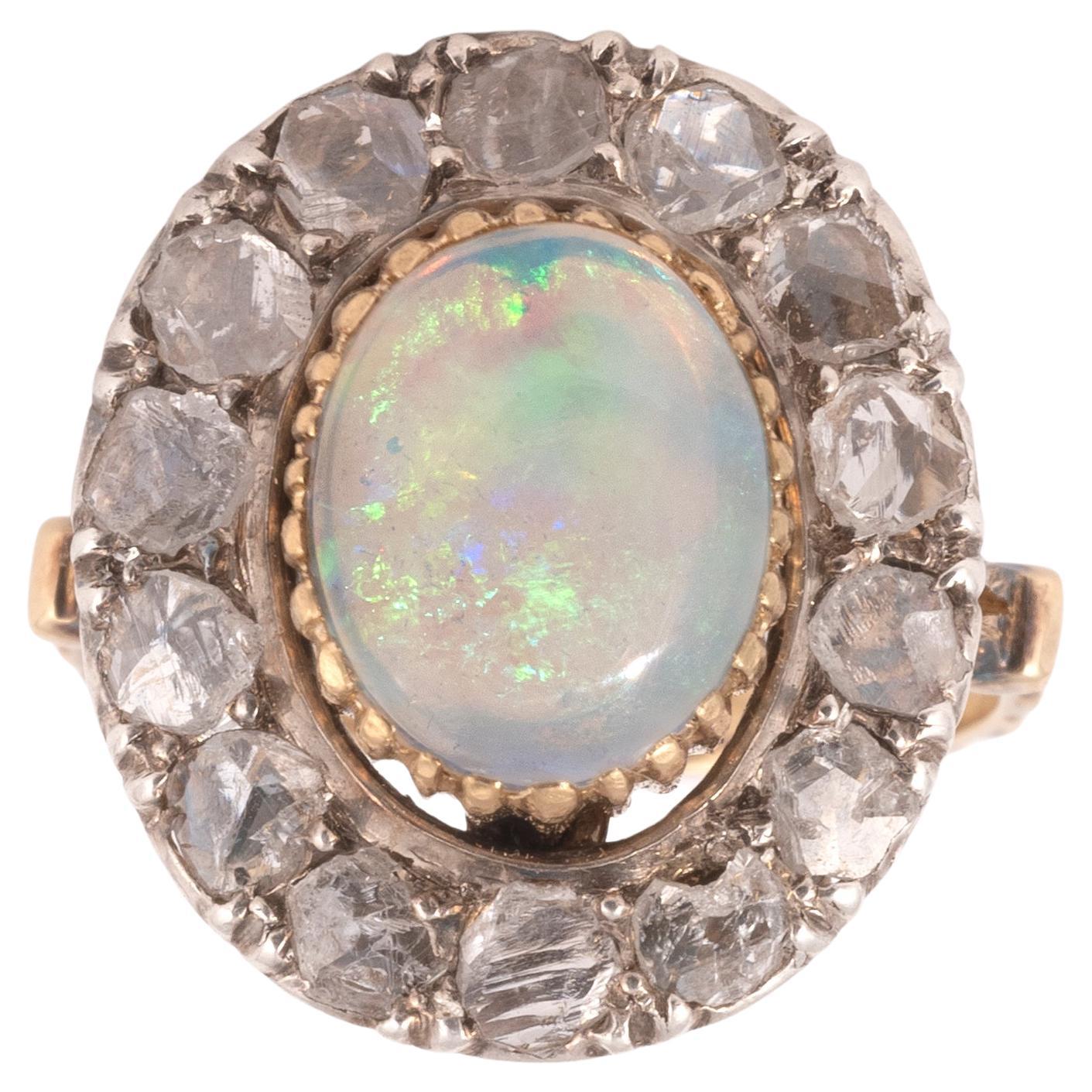 Round design with central oval cabochon opal and rose diamond cluster.
Size: 5
Weight: 5.09gr.
Follow on instagram @bernardoantichita