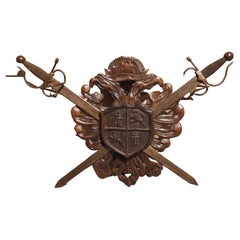 Early 1900s Carved Wooden Coat of Arms Plaque with Crossed Swords