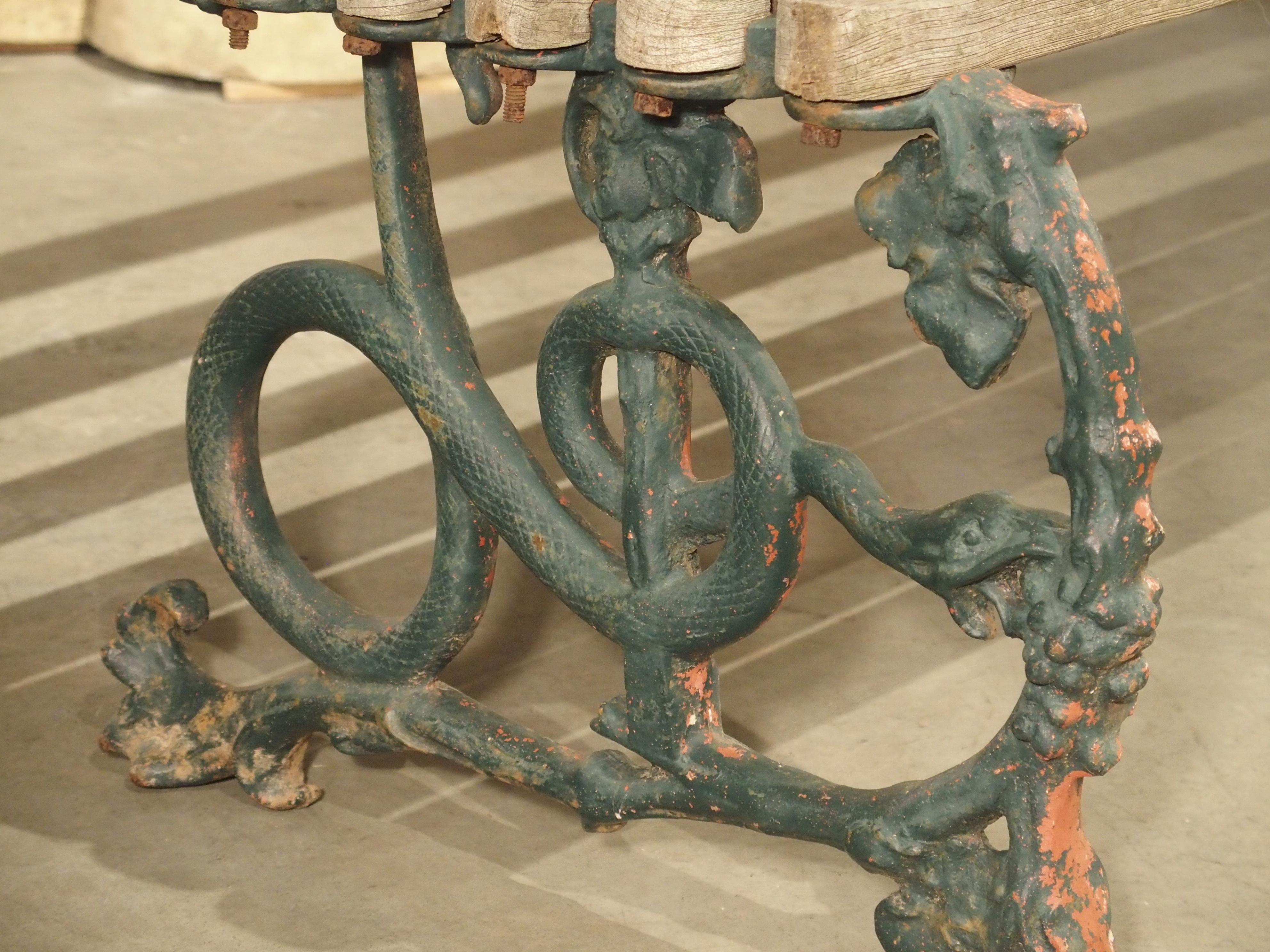 Early 1900s Cast Iron and Wood Bench with Dog Head and Serpent Supports In Good Condition In Dallas, TX