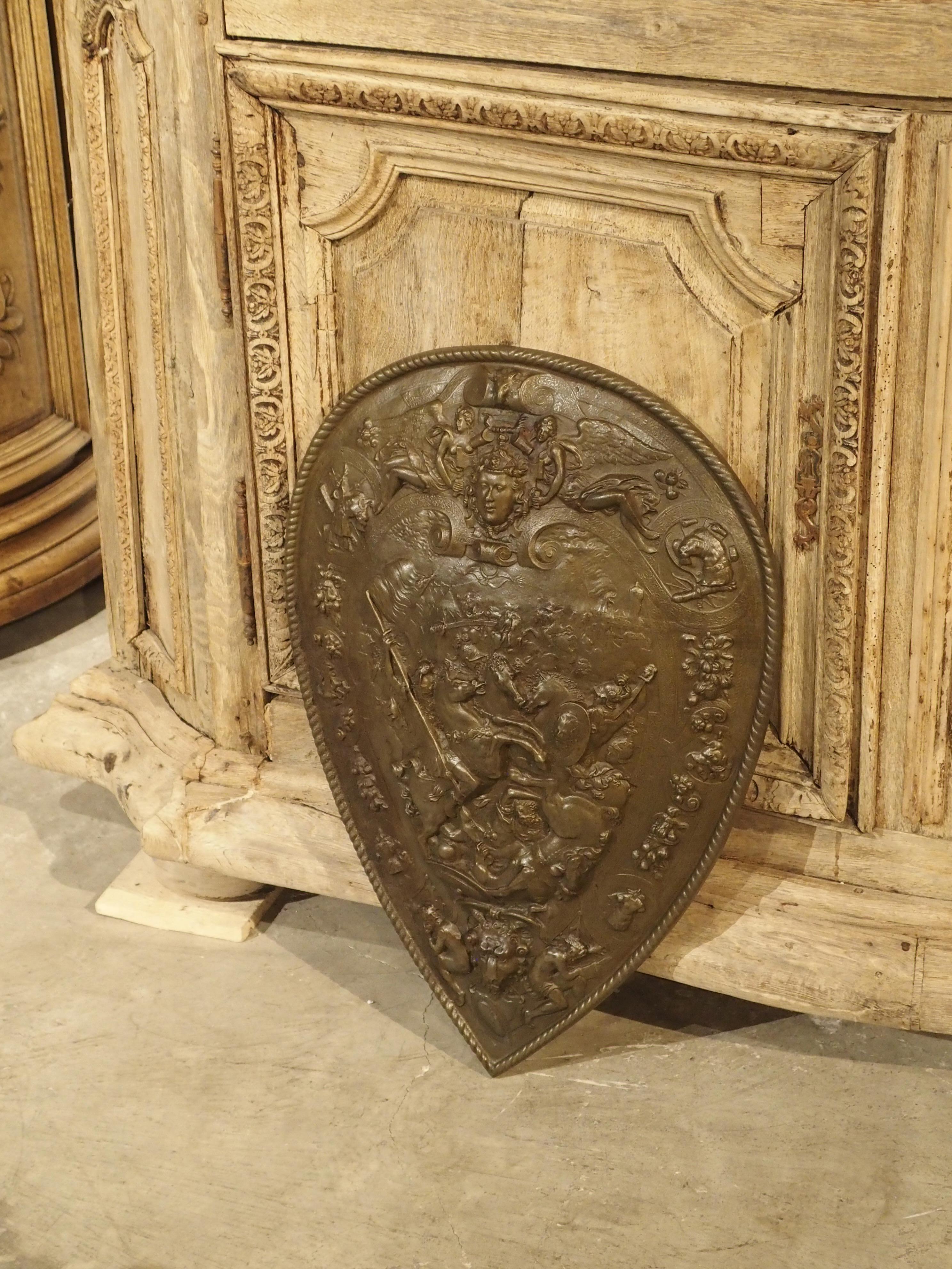 This decorative and highly detailed shield is based on the original King Henry II parade shield which resides in the Metropolitan Museum of Art, circa 1555. It’s called ‘parade armor’ because it was never actually intended for war. It was