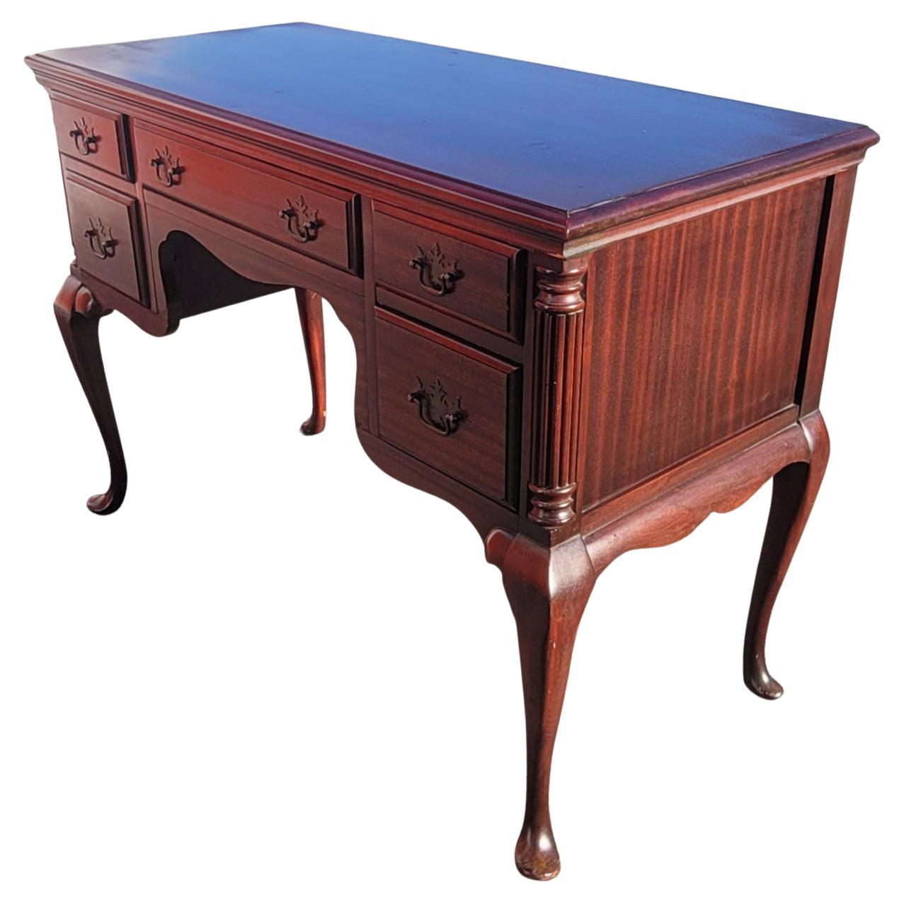 A beautiful and patinated Early 1900's Chippendale genuine mahogany desk / vanity with mirror in good condition. Beautiful mahogany grain. Dovetail drawers construction with patinated original drawer pulls. Perfectly functioning drawers. Desk Vanity