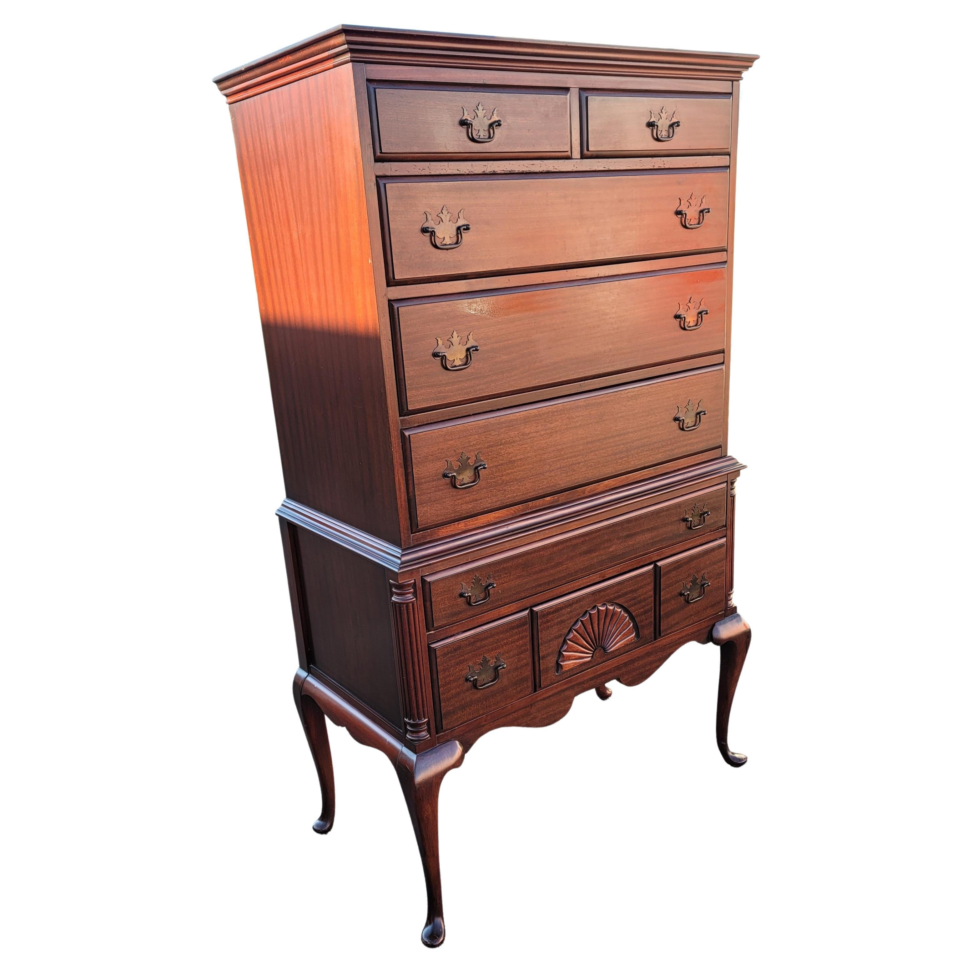 A beautiful and patinated Early 1900's Chippendale genuine Mahogany highboy chest of drawers in good condition. Beautiful mahogany grain. Dovetail drawers construction with patinated original drawer pulls. Perfectly functioning drawers. Measure