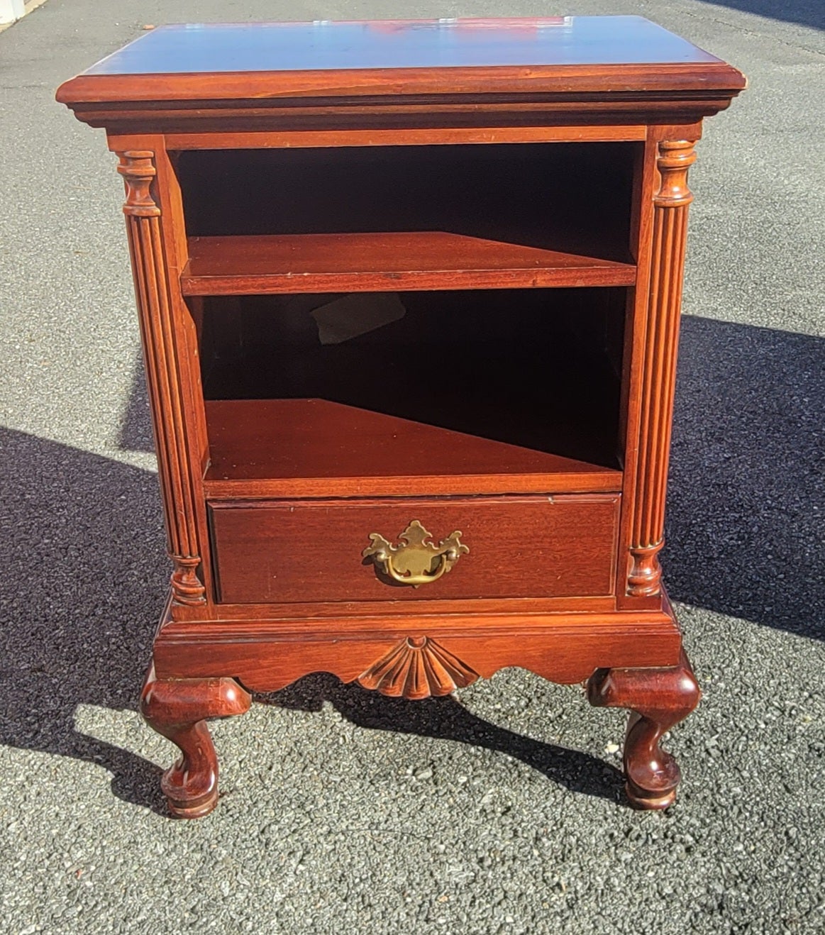 A beautiful patinated Early 1900's Chippendale genuine Mahogany tiered drawer bedside table in good condition. Beautiful mahogany grain. Dovetail drawers construction with patinated original drawer pulls. Perfectly functioning drawer and a wiring