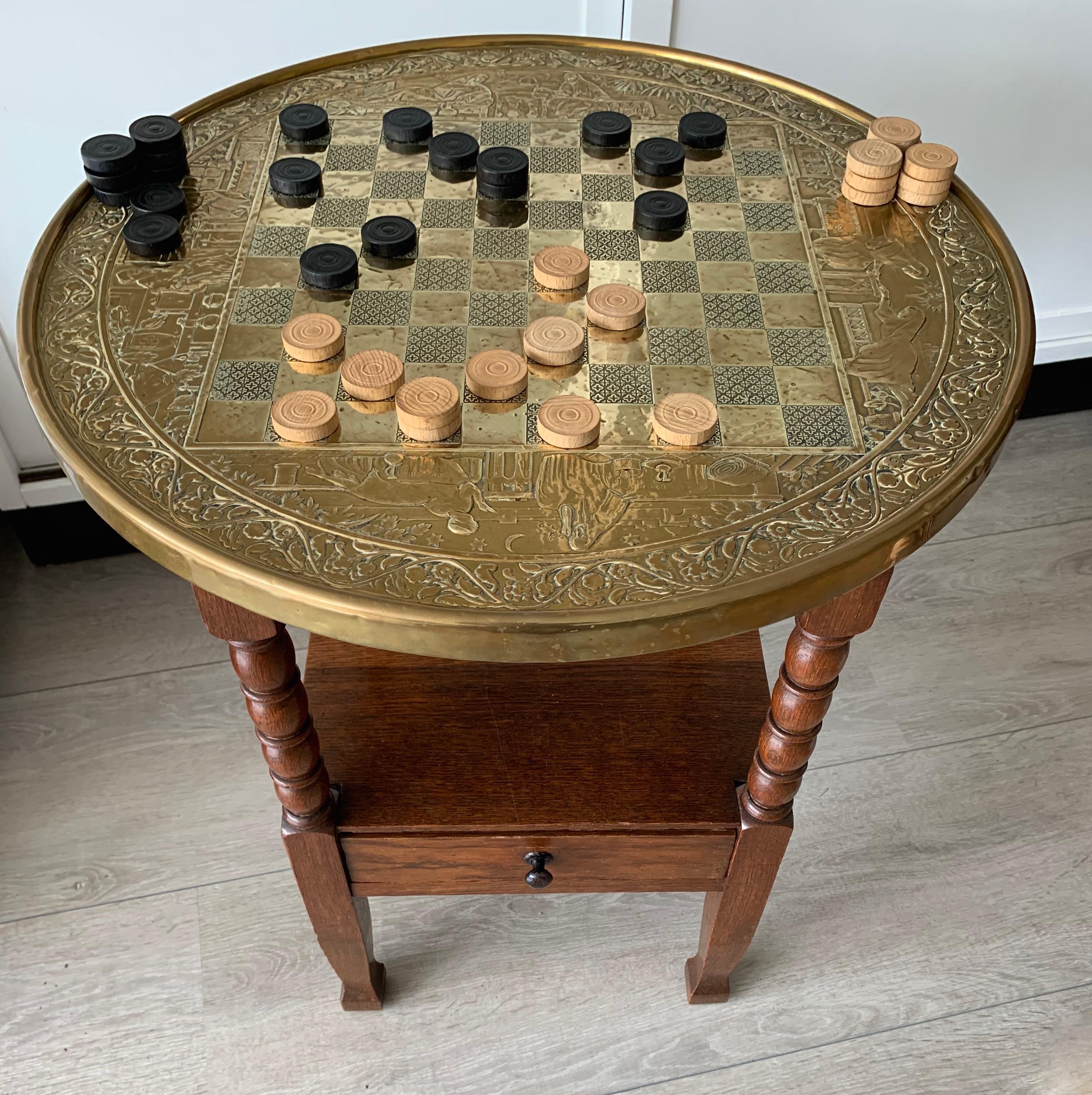 Antique and artistic Arts & Crafts checkers game table with a warm patina.

This striking games table is another one of our recent, great finds. Not only is this a rare antique checkers table, the handcrafted and embossed images of people from