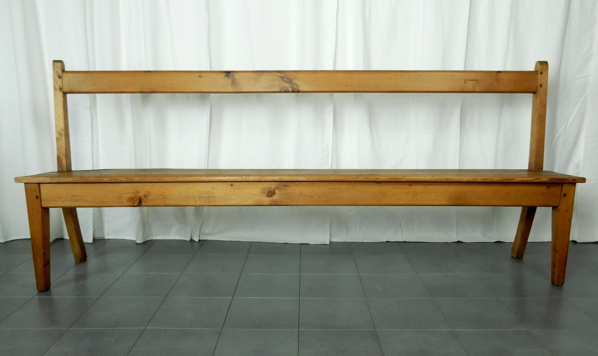 Linear 7 foot long knotty pine bench skillfully crafted and secured with whittled wooden pegs.
Completely original with no repairs. Solid and ready for use.