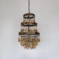 Early 1900s French Brass Waterfall Chandelier Frame Dressed in Peach and Amber
