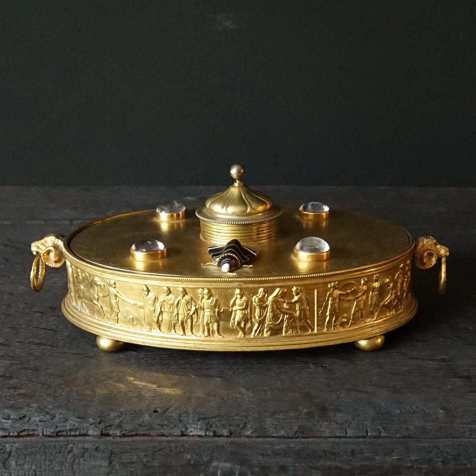 Very pretty and heavy early 1900s Neo-Classical oval brass jewellery box with 2 moth decorations carved in agate.
The figures on the (I think machine made repoussé) side look like from Roman times.
The middle-eastern little tent shaped lid feels