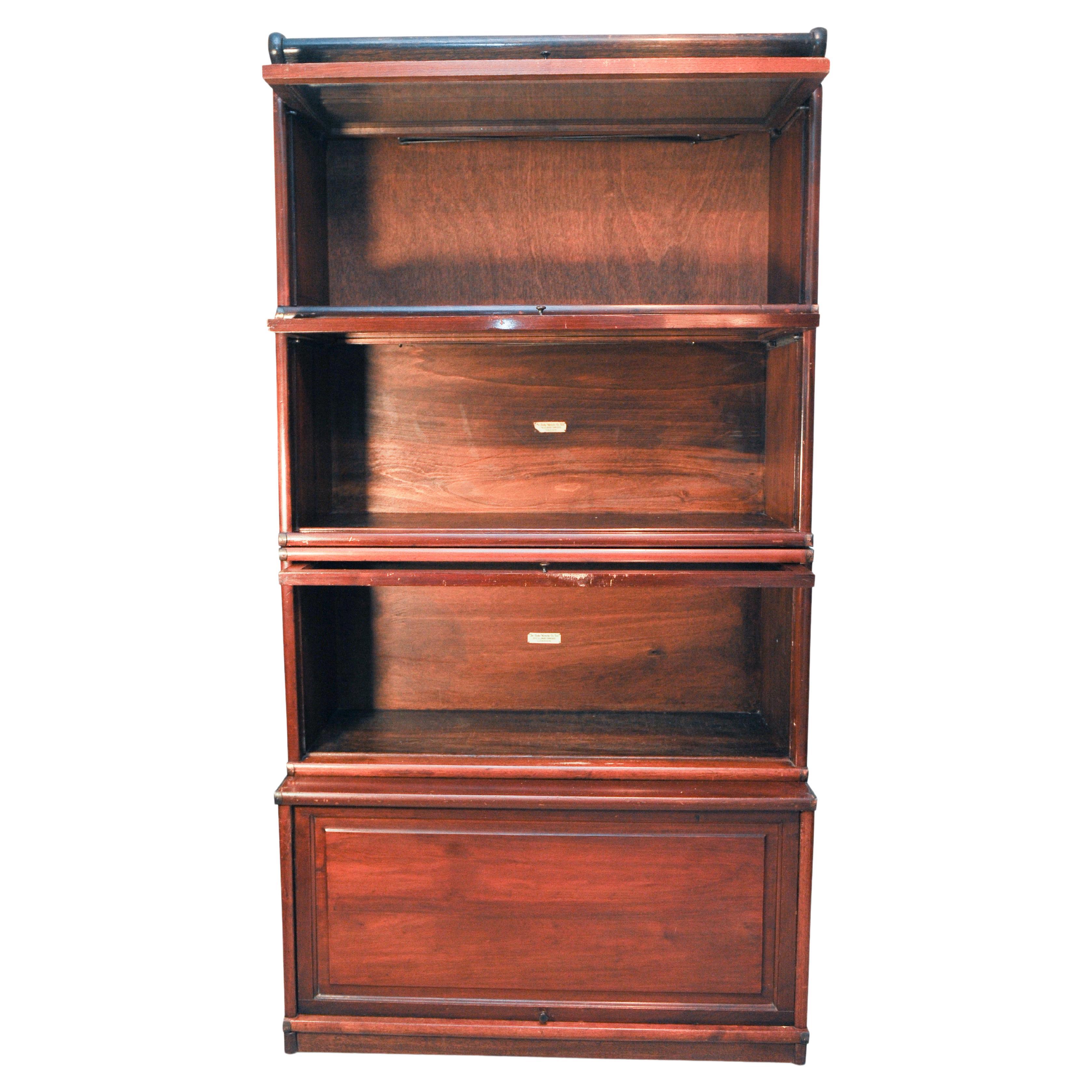 Globe Wernicke four tier glazed sectional / modular / barrister's bookcase 1920s

Comes apart in sections for easy transportation.

With original ivorine Globe-Wernicke Co of London logos.

Globe-Wernicke was formed as a result of the