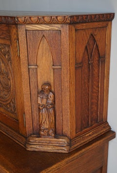 Early 1900s Gothic Revival, Hand Carved Two Piece Oak Cabinet w. Monk Sculptures