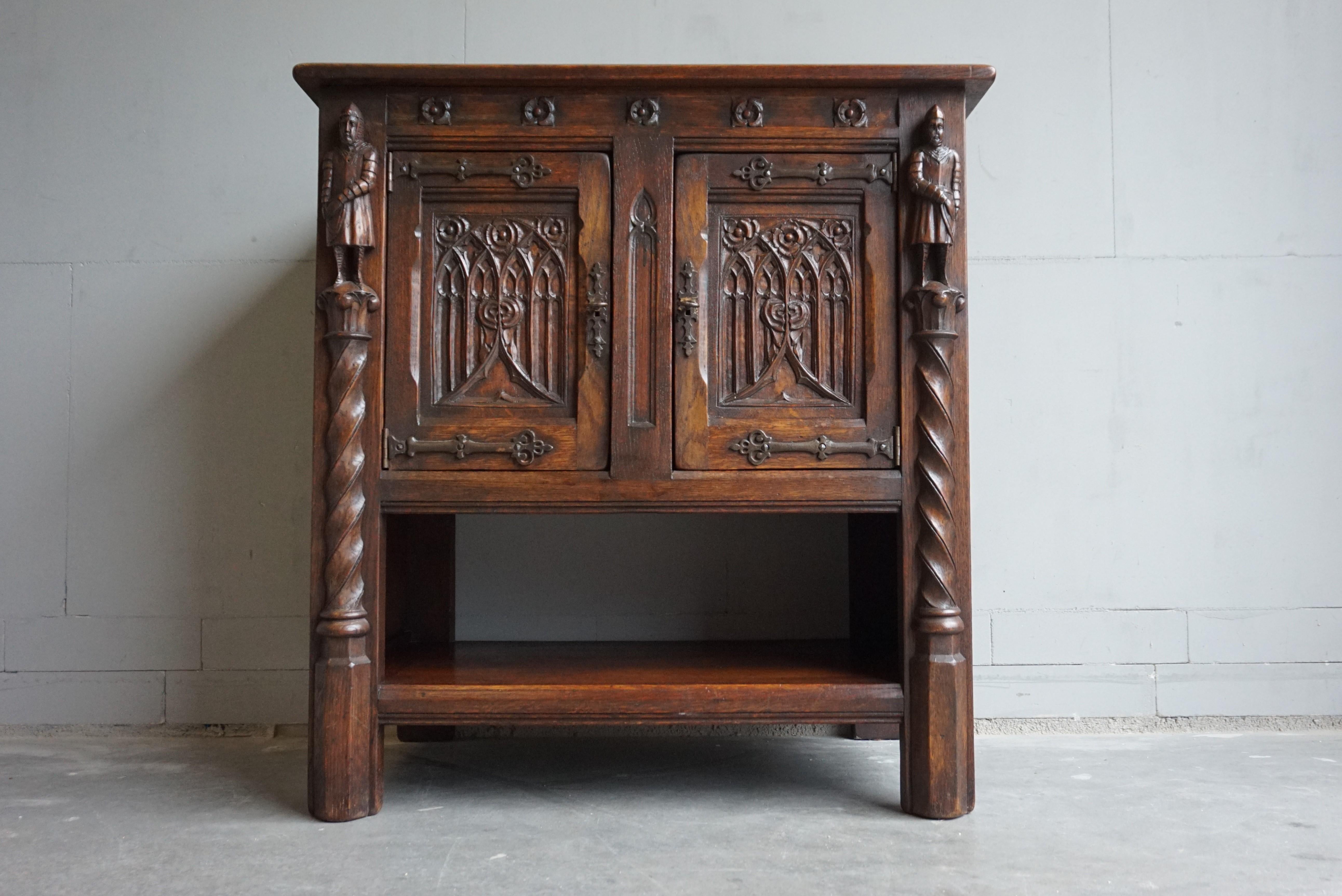Marvelous and practical Gothic Revival drinks cabinet with knight sculptures and more.

This rare, Dutch Gothic dry bar truly is in excellent condition. This beautifully hand carved cabinet comes with two knights who look like they are guards to the