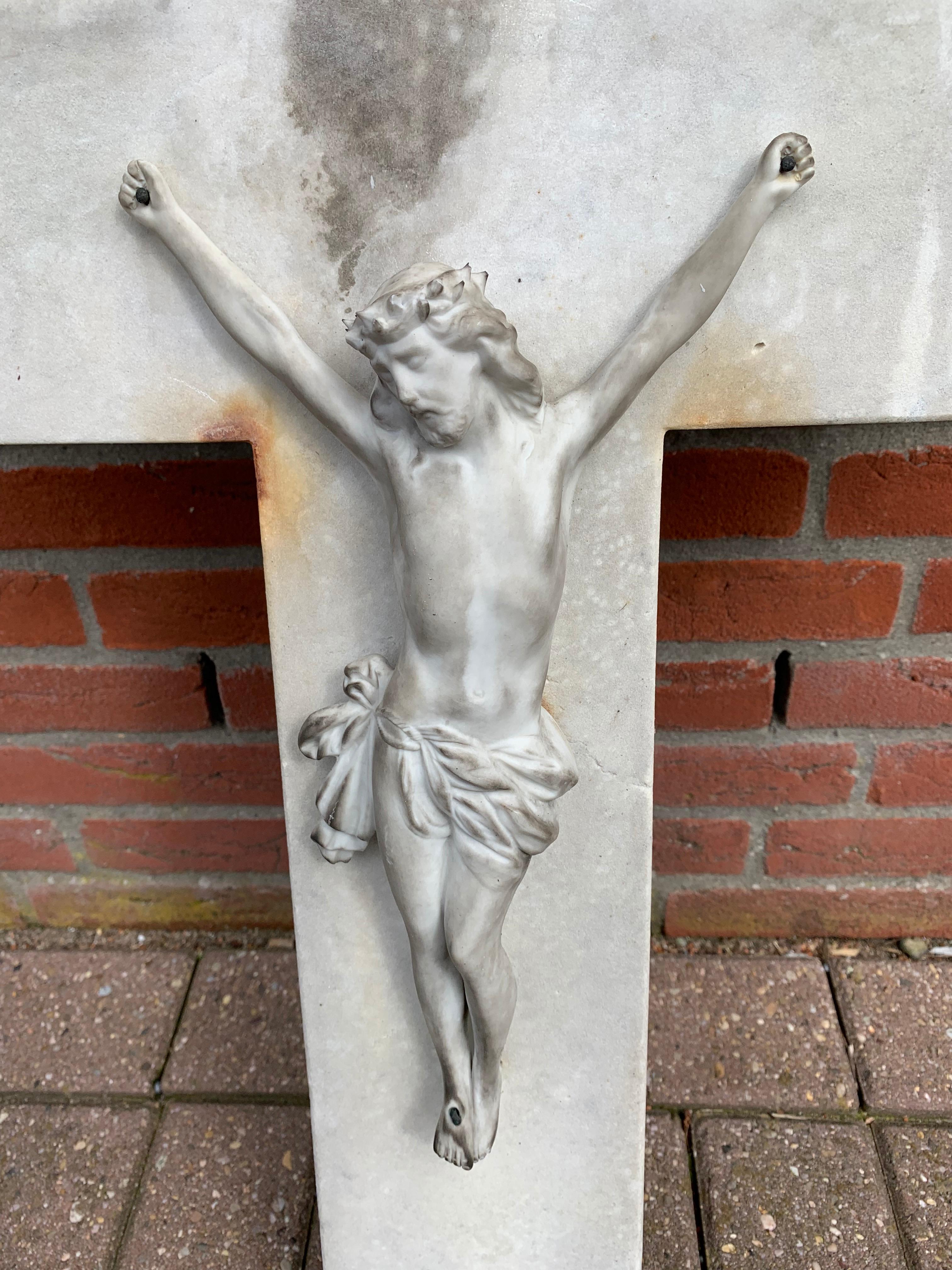 Antique, large and heavy work of religious art.

If you are looking for rare and eye-catching antiques then this recent find could be perfect for you. This rare crucifix is entirely hand carved out of solid, white marble which also makes it the