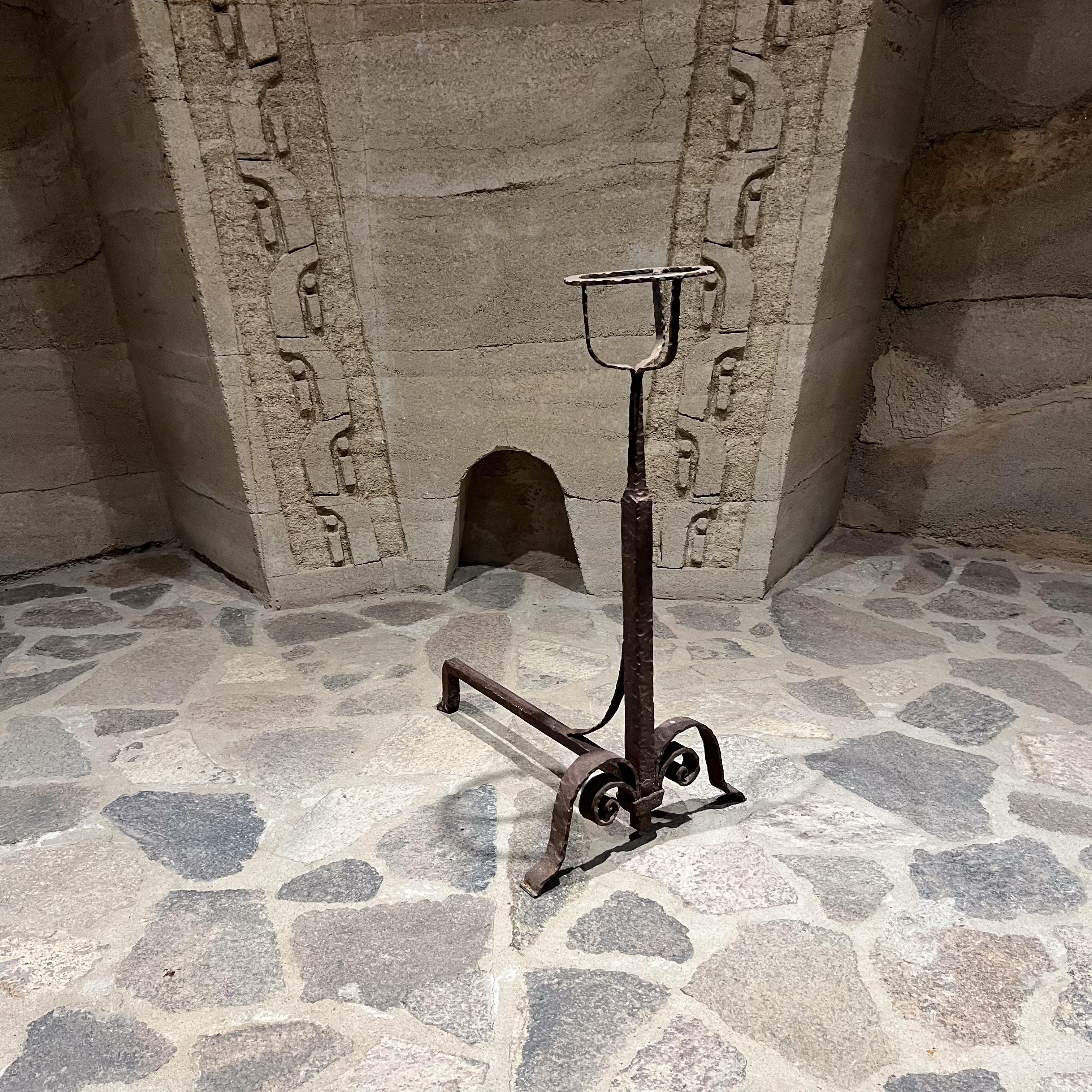 Early 1900s hand forged andiron candleholder circular opening for light or candle placement.
Handcrafted
USA circa early 1900s late 1800s
Beautiful work hand hammered texture
original unrestored patina.
34 h 17 d x 24.5 d- candle opening diameter