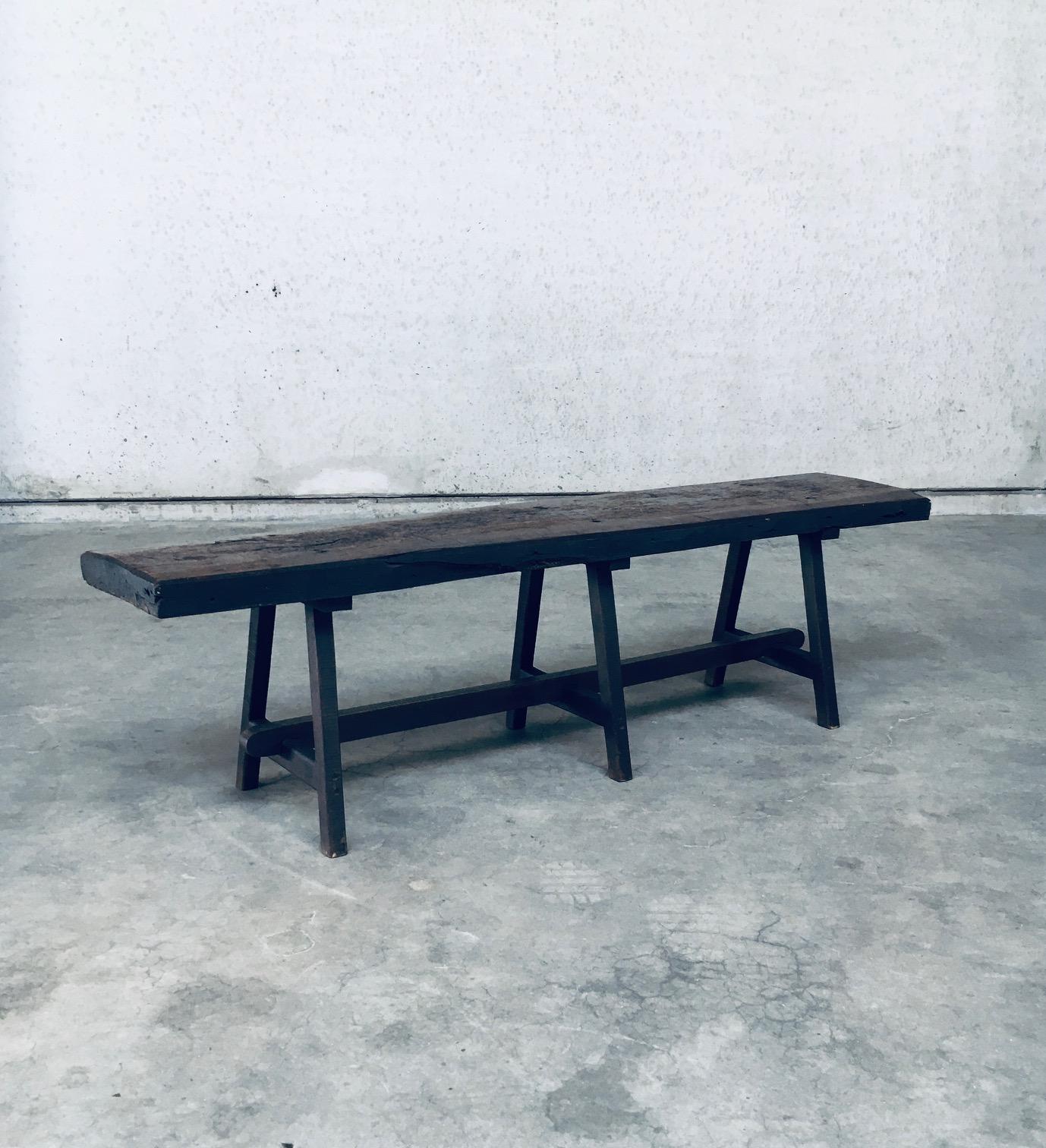 Vintage Early 1900's Handmade Wabi Sabi Style Rustic Design Bench. Made in Belgium, Late 1800's / early 1900's. Solid piece of oak as top and well constructed legs in oak wood. Oak slab top and legs are all dark stained. The bench comes from an old