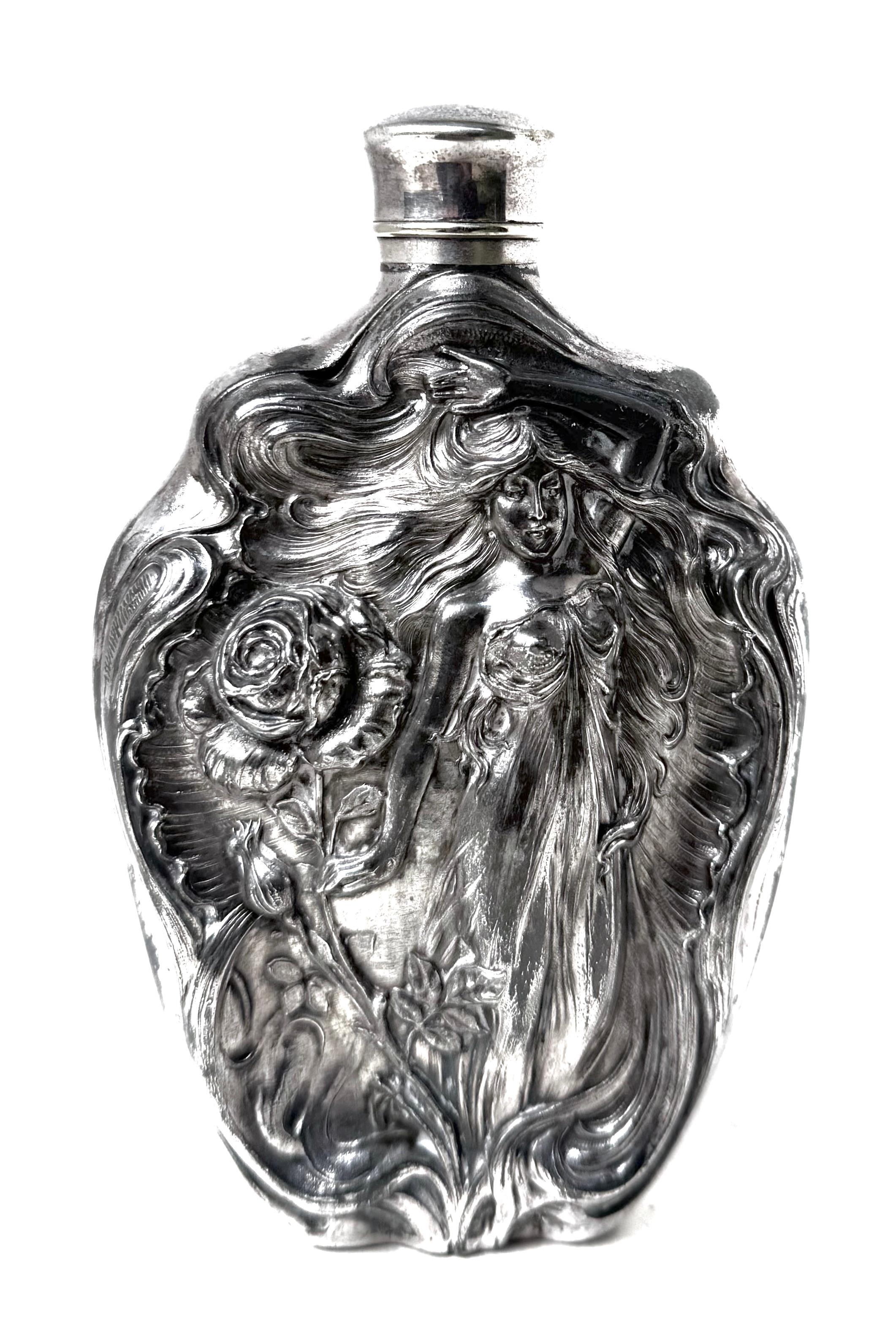 Lovely Art Nouveau hand crafted liquor flask repousse hand crafted design made by the Victor Silver Company, Meriden, Connecticut circa 1905. In all original very good condition with no repairs, dents, or any restoration of any kind; the flask has