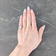 Early 1900's Opal Diamond 14 Karat Yellow Gold Antique Halo Ring