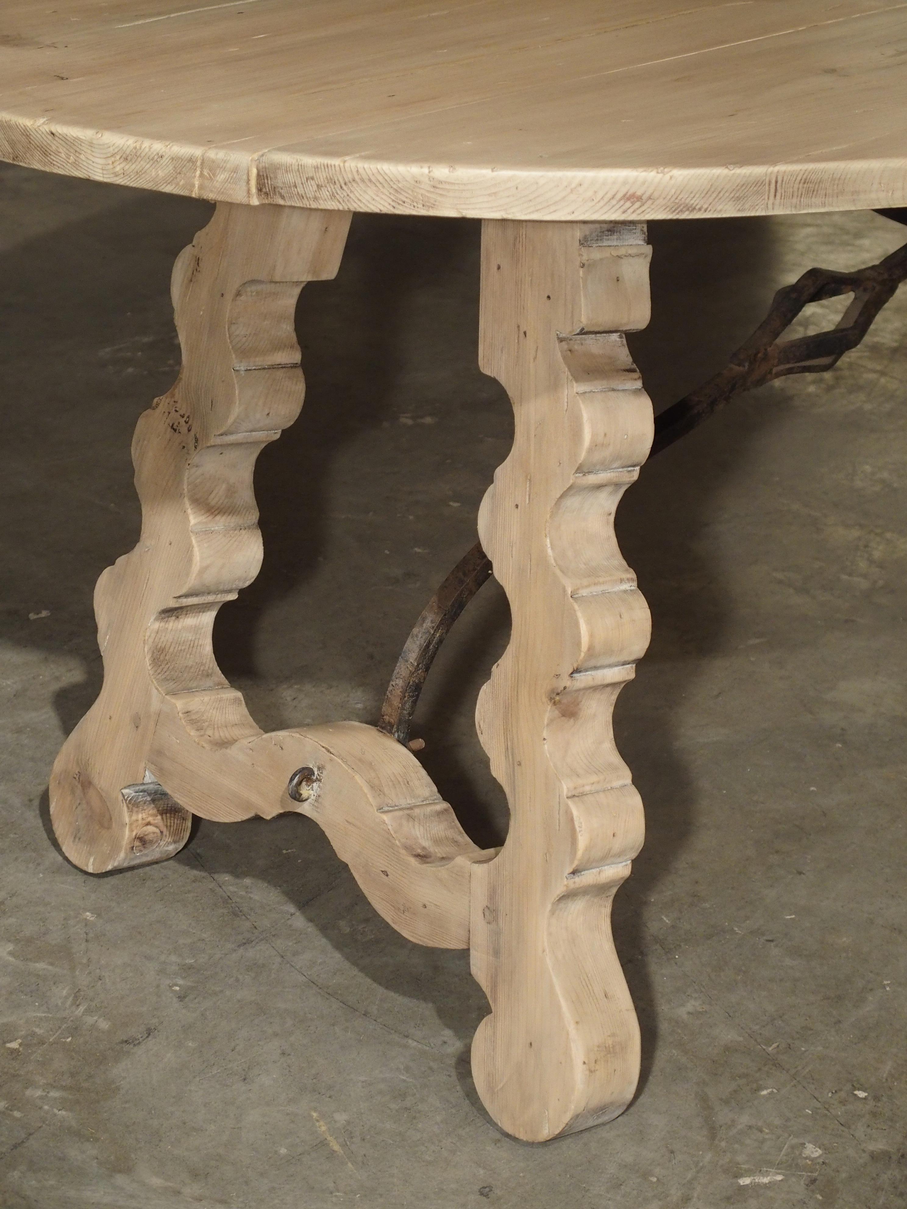 Carved Early 1900s Oval Spanish Drop-Leaf Table with Iron Hardware