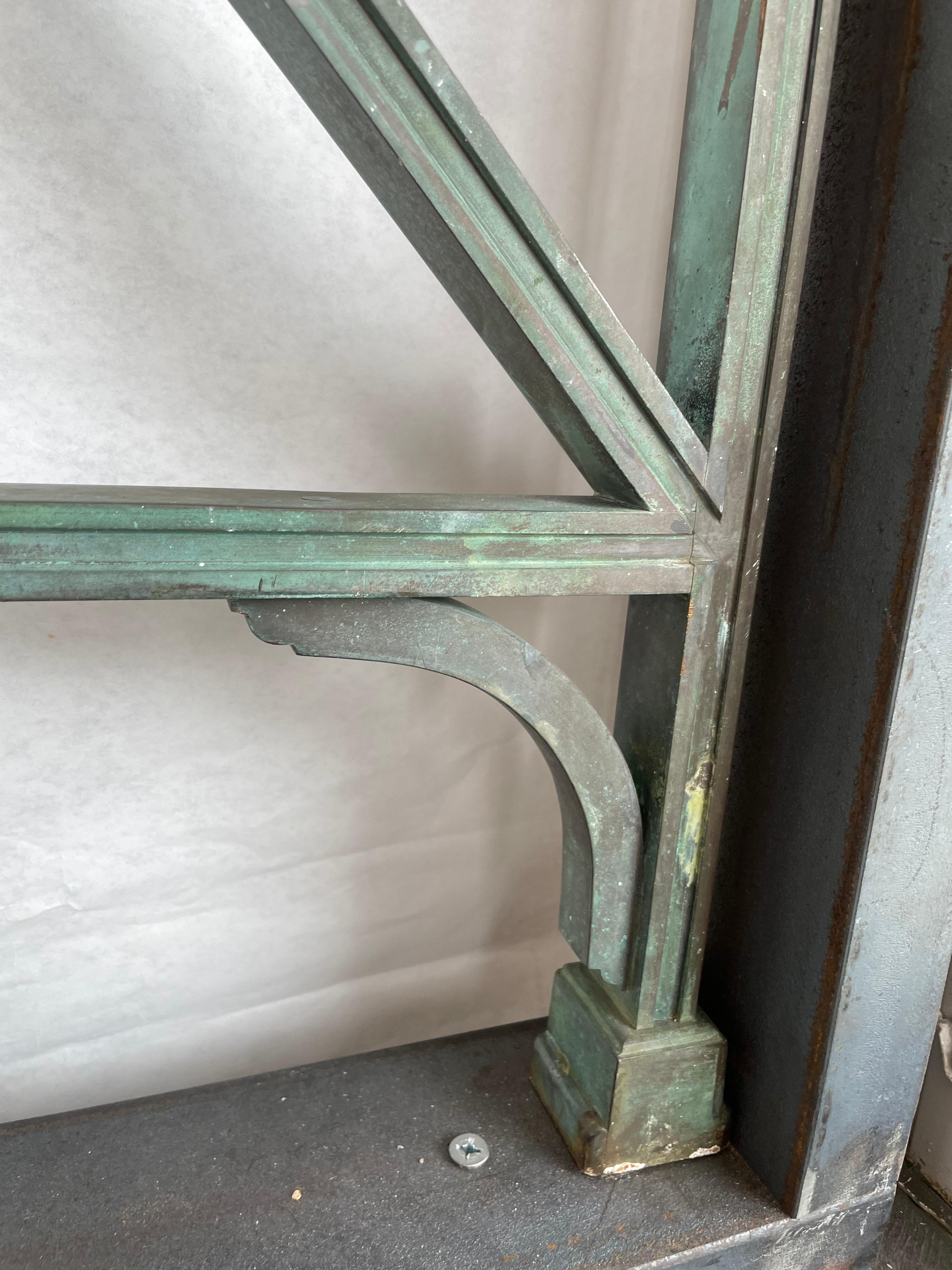 This classic early 1900's bronze pedestrian or garden gate door with central medallion and clean geometric lines is extremely heavy and shows the exquisite green patina from age and wear. 29 inches square for main panel and 37 inches tall with the