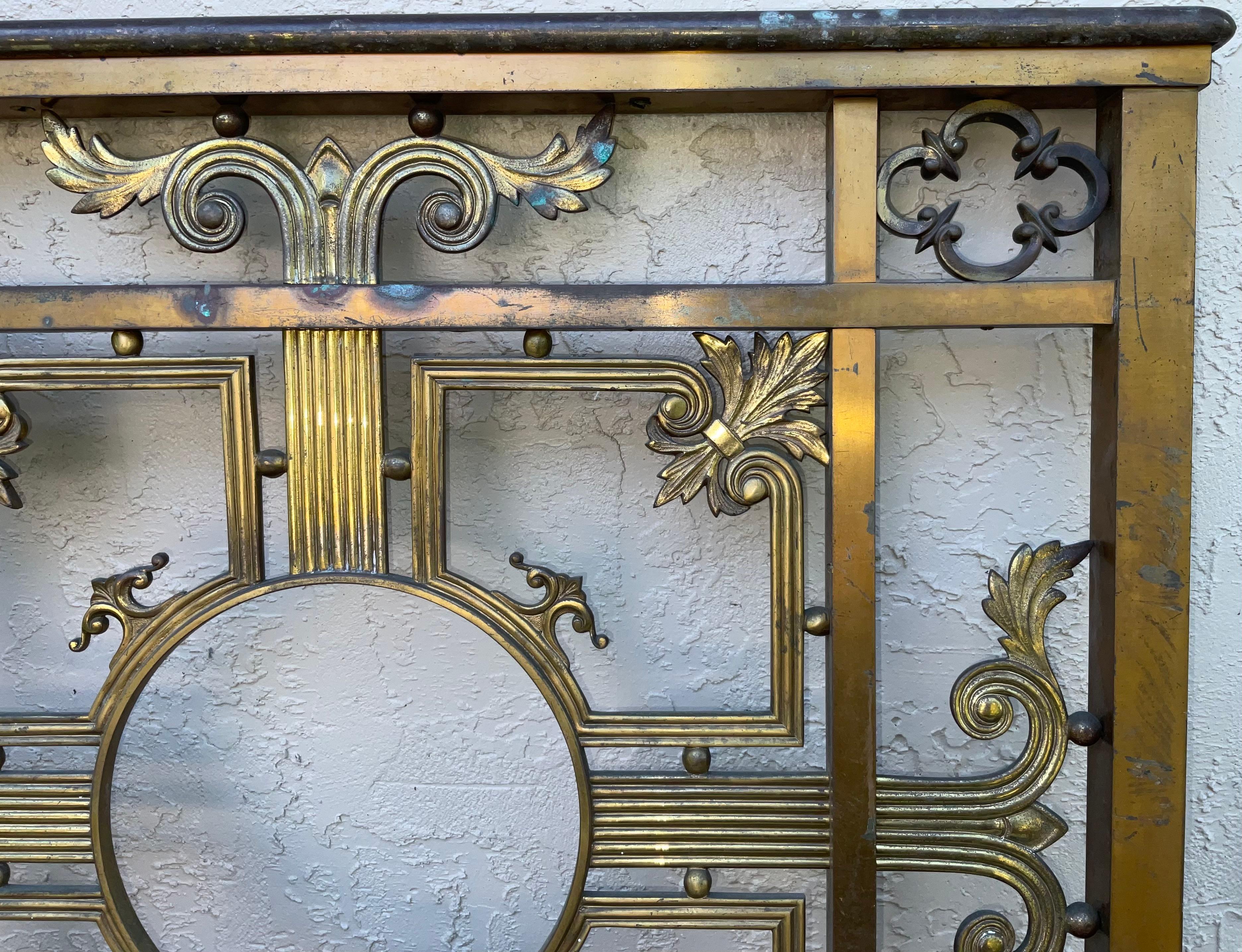 This classic early 1900's bronze pedestrian or garden gate or indoor door ,with central medallion , was salvage probably from a bank or big institution building .
exquisite and decorative motif , part of Americana salvage .
Could be converted with