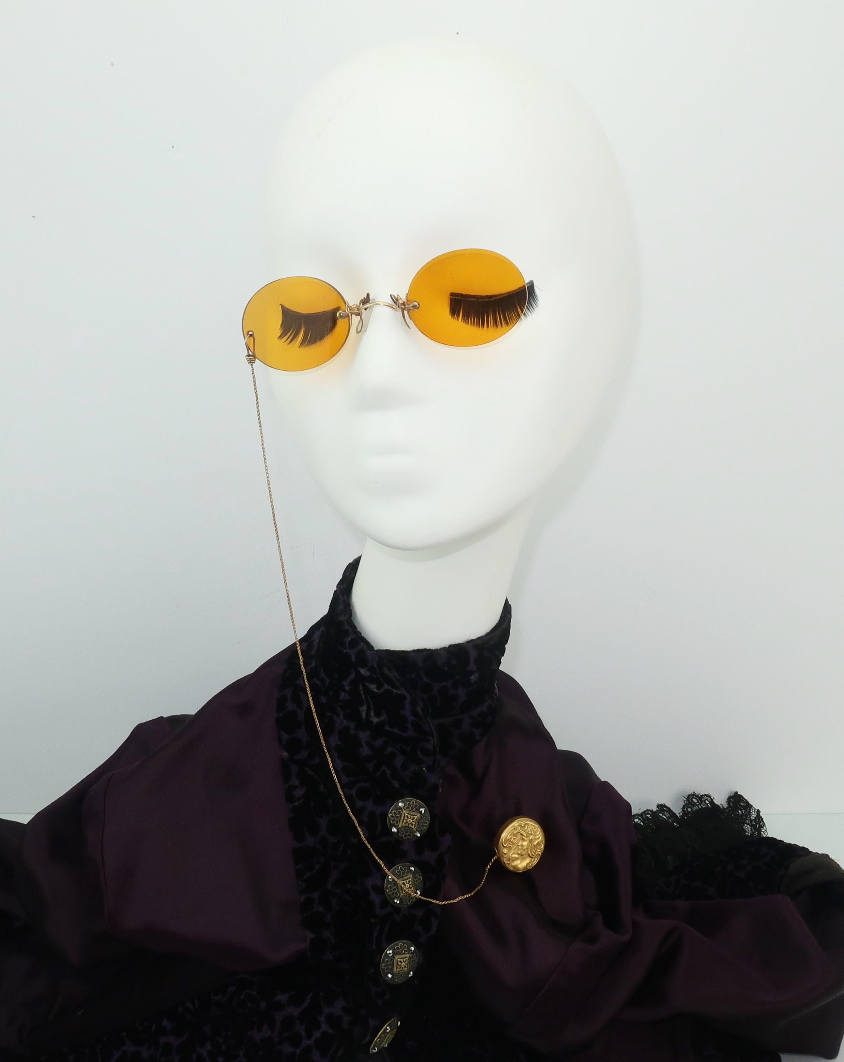 A rare fashionable gadget from the past!  These 1903 Ketcham & McDougall amber glass pince nez sunglasses were always in reach for a lady of means at the turn-of-the-century.  They are attached to an 'eye glass reel' ... a retractable fob chain and
