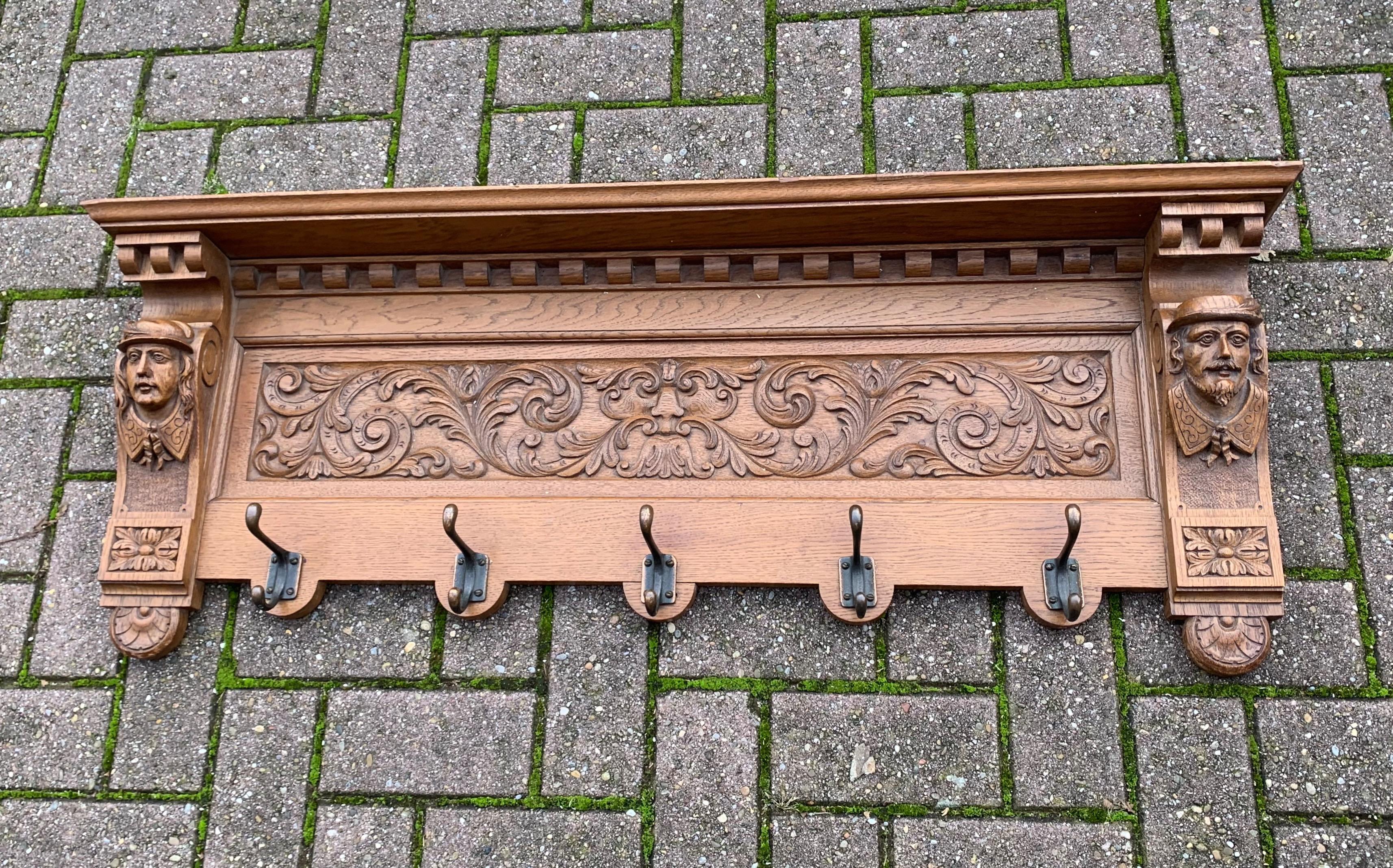 Antique and sculptural oak wall coat rack.

This striking antique Dutch coat rack is special, practical and highly decorative. It is special, because of the quality of the marvelous carvings and its excellent condition. It is very practical, because