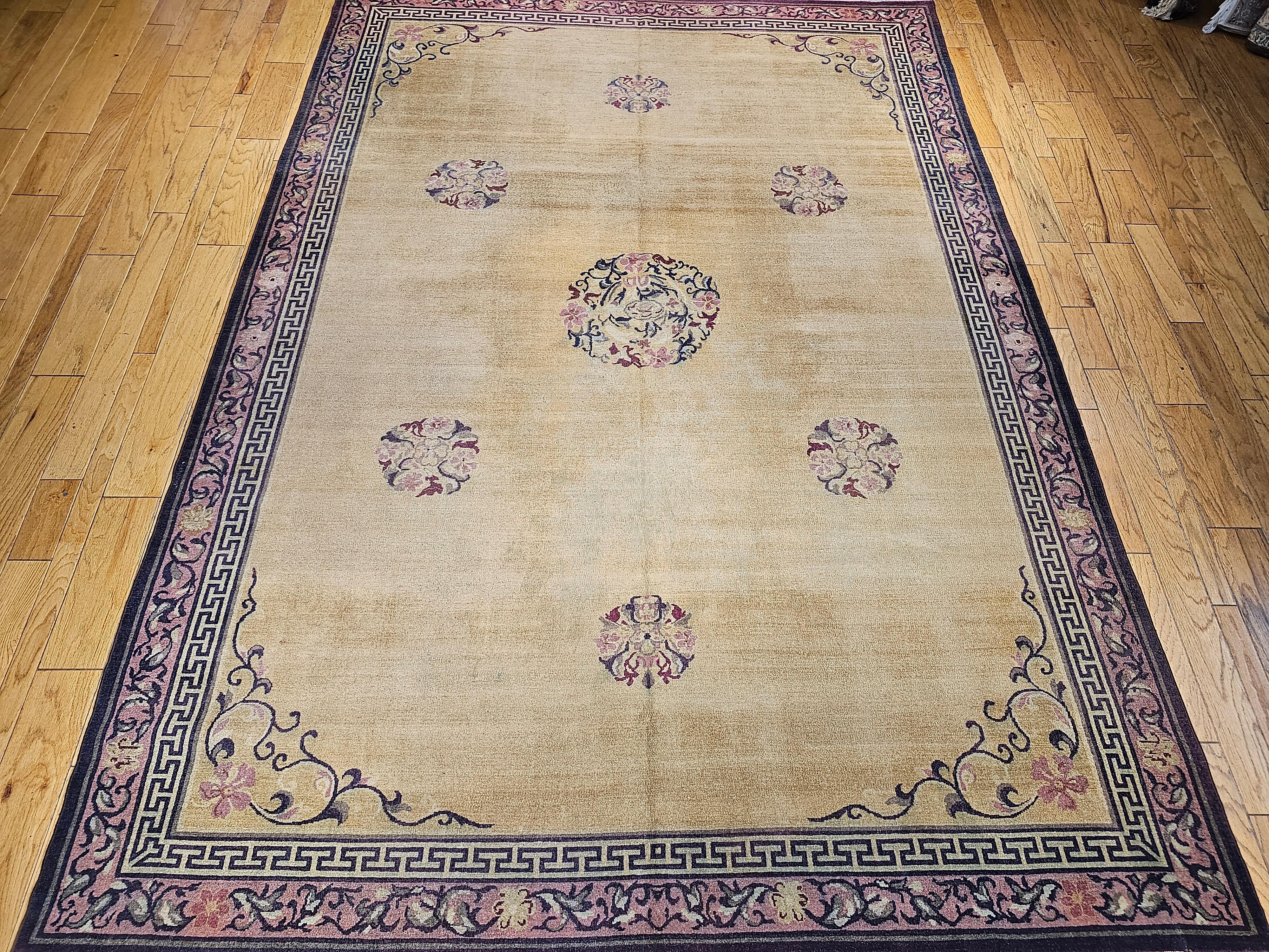 A beautiful room size Indian Agra in pastel oatmeal or pale yellow color.  Simple design but breathtakingly beautiful! The rug has a collection of seven motif medallions with the largest one in the center and the others around the field.   The