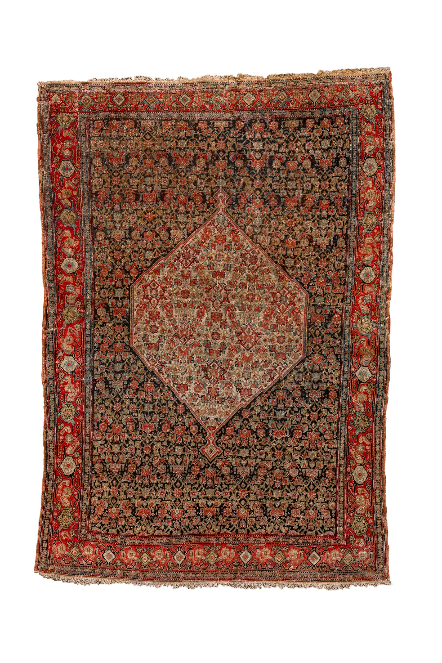 A single wafted, cotton foundation Kurdish city scatter with the characteristic sandpaper texture, and a small scale Herati pattern in both the bear black field and the ecru central medallion. Red main border with wonky reversing turtles. Fine