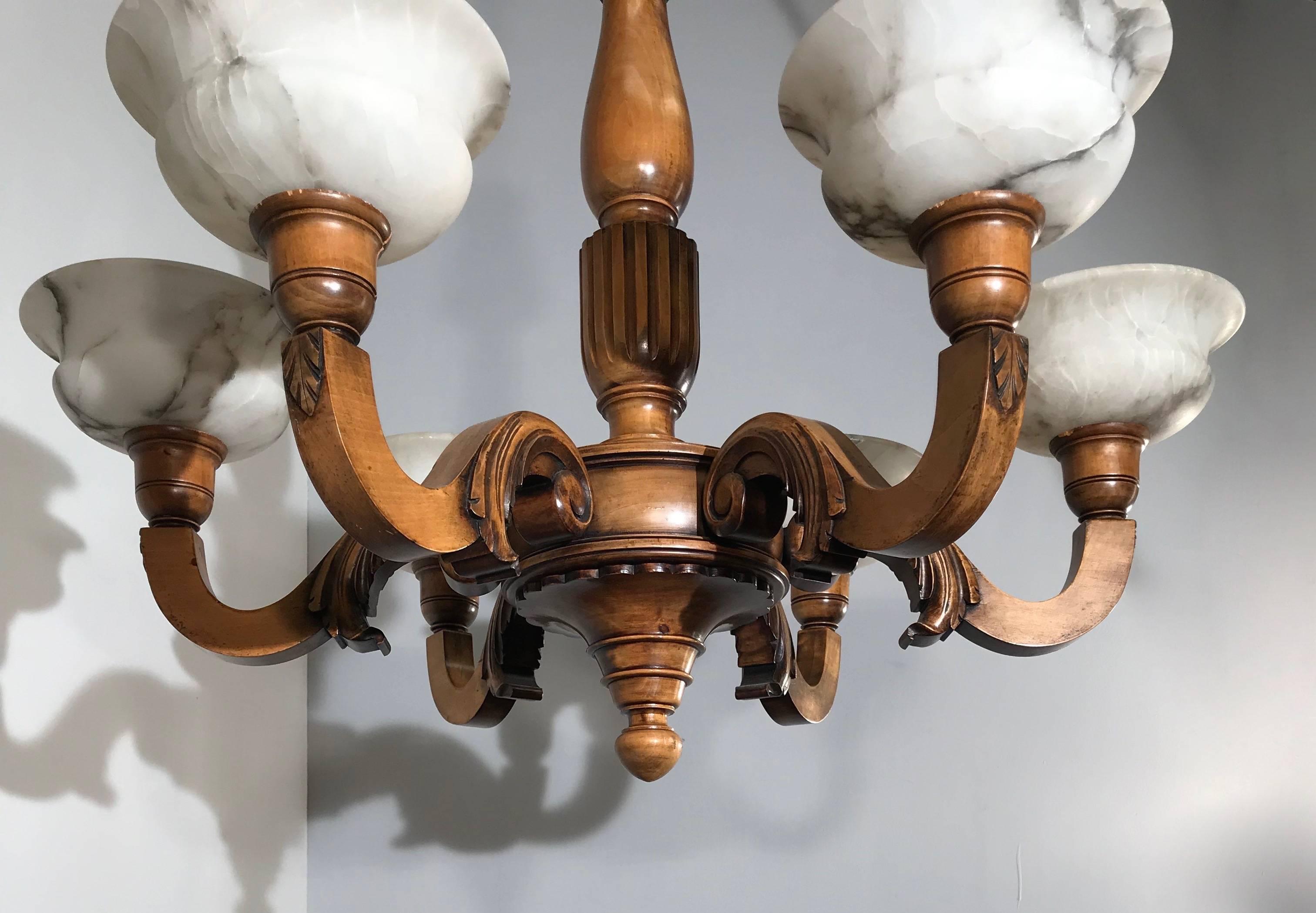 Stylish and all-handcrafted chandelier from the turn of the century. 

This good quality and practical size, hundred years old pendant has six perfectly and evenly carved arms. This turn of the century workmanship pendant is made of beautiful