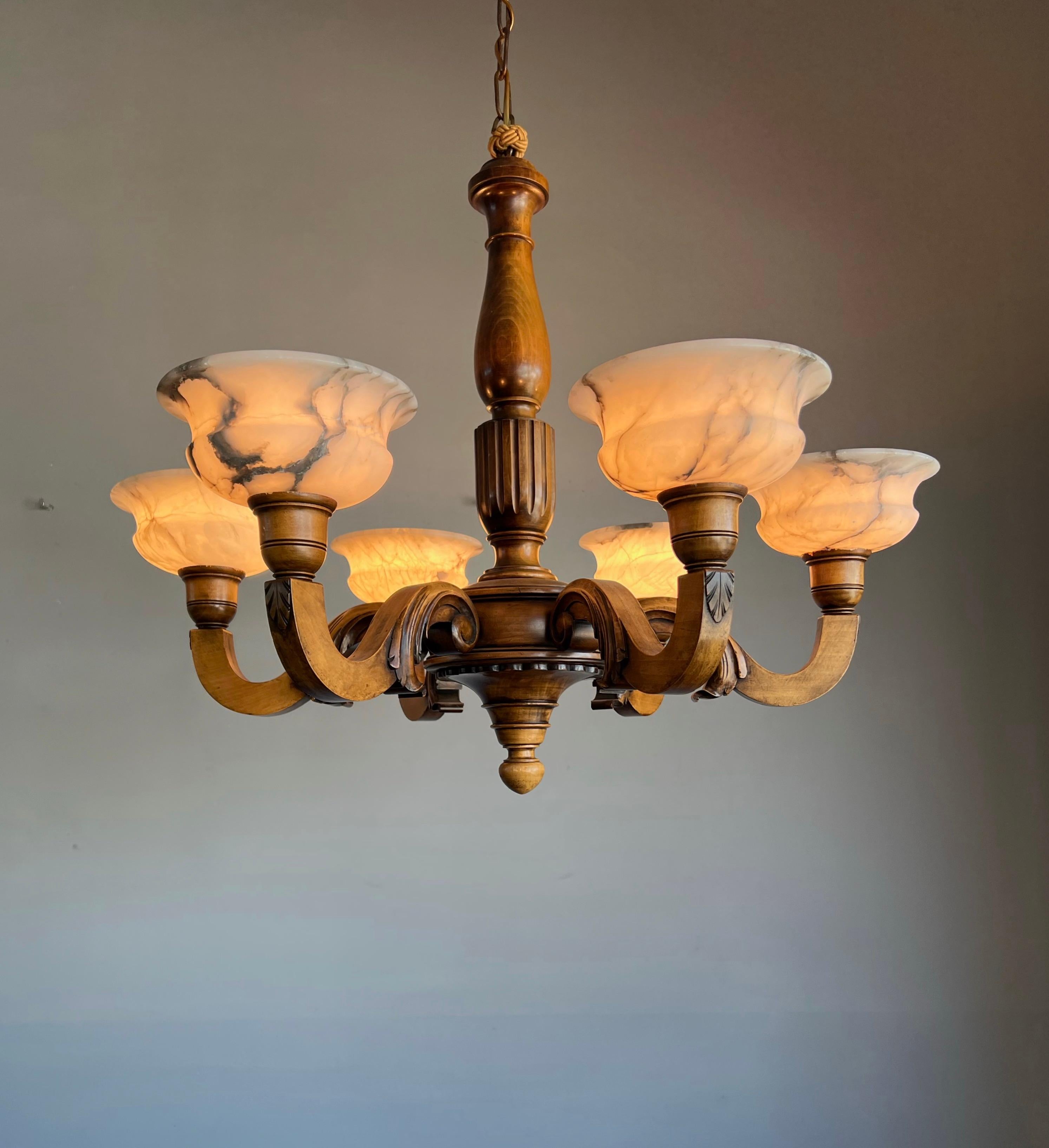 European Early 1900s Six Light Quality Carved Wood Chandelier with White Alabaster Shades
