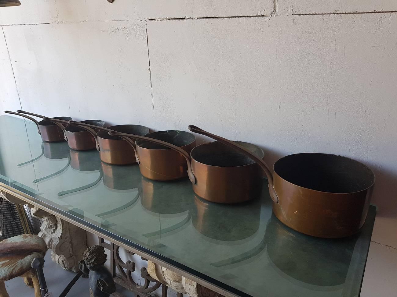 For sale at the antique company: Old and heavy six-part French copper cookware with tinned inside and metal handles, from circa 1900.

The measurements are,
Depth 15 cm, 17.5 cm, 20.5 cm, 21.5 cm, 23, 5 cm and 25 cm/ 5.9 inch, 6.8 inch, 8 inch,