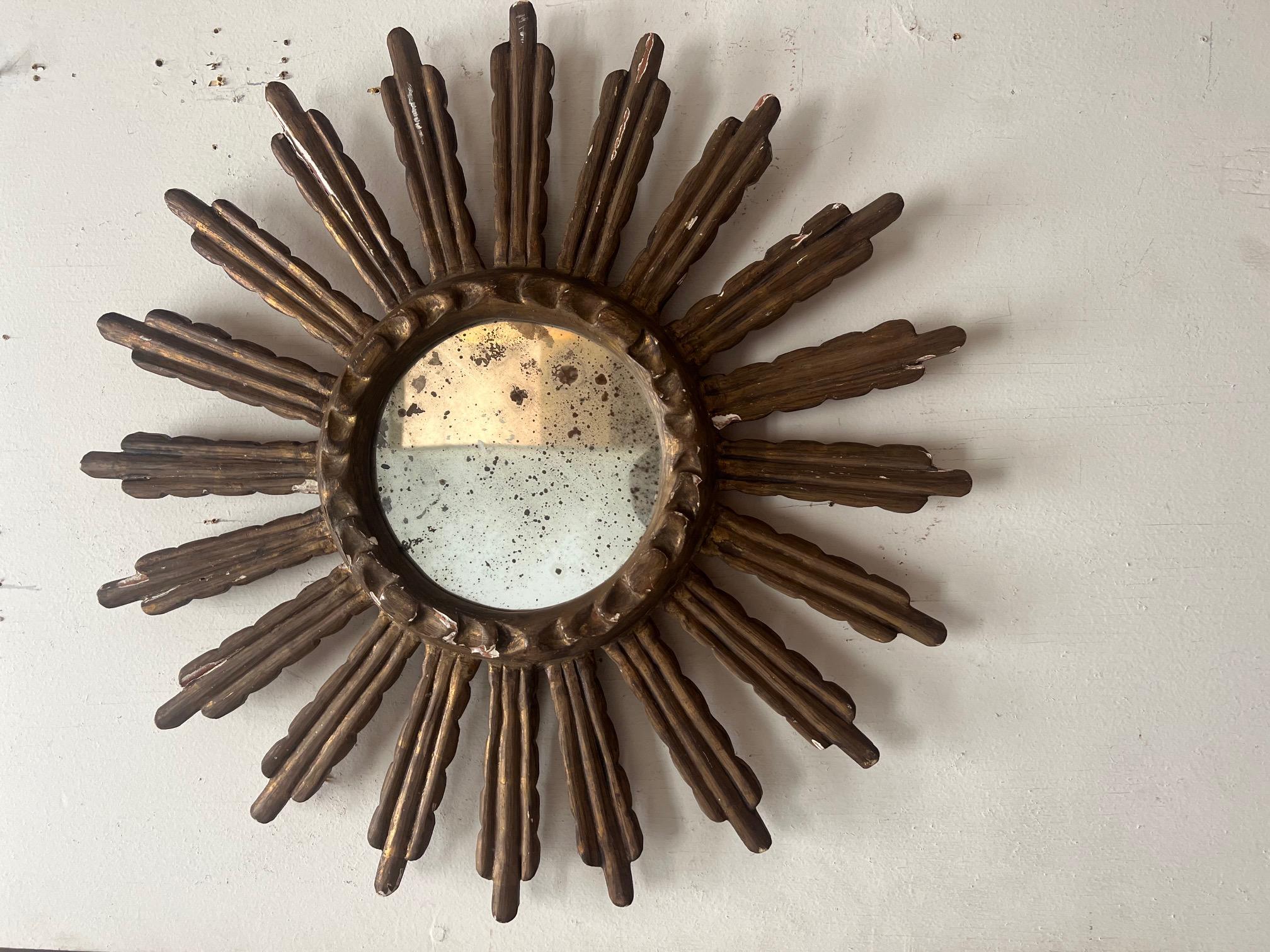 Early 1900's Sunburst great detailing highly distressed mirror in the center of the frame.