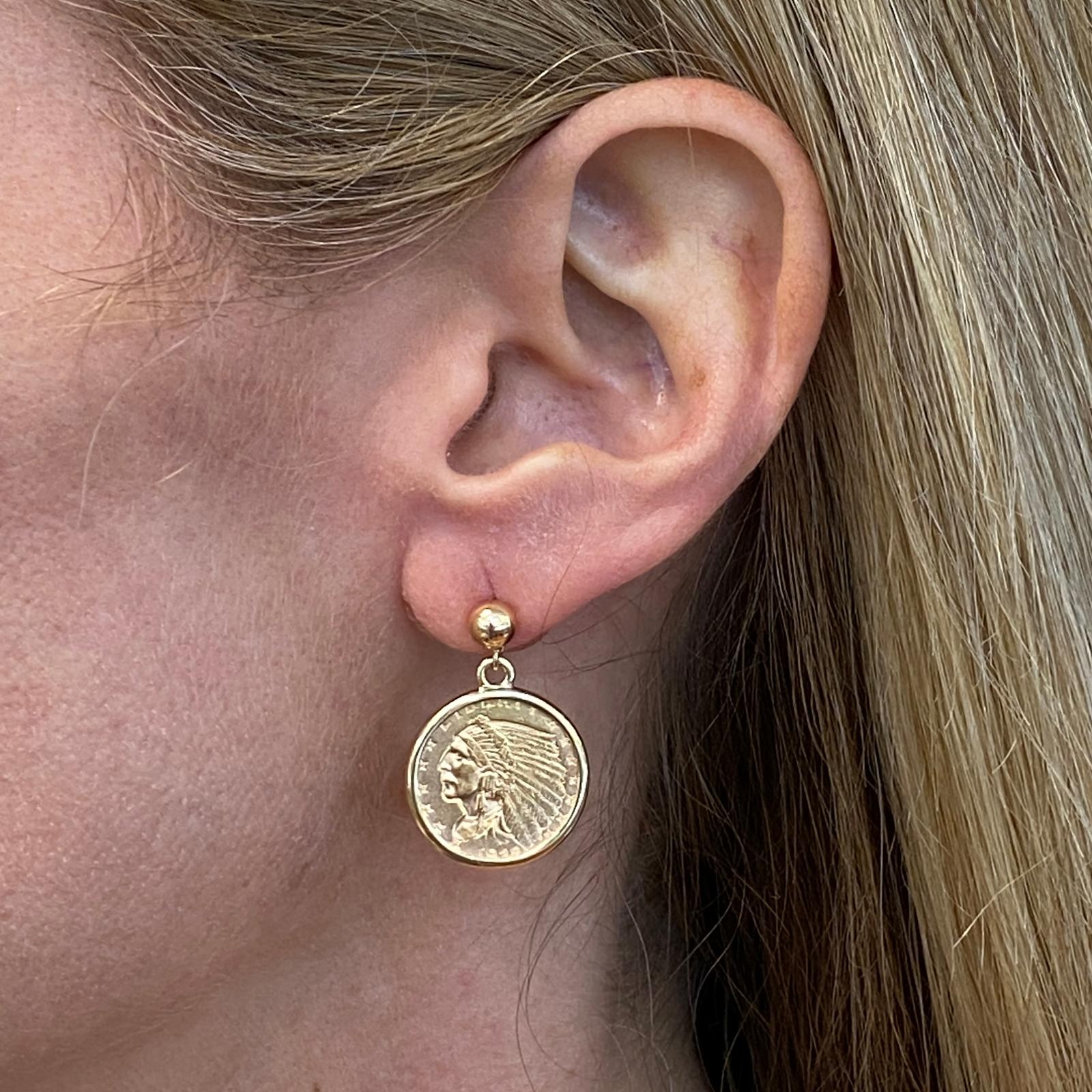 Original 90% gold US Indian Head coin drop earrings are crafted in 14 karat yellow gold bezels. The coins are $2.50 dollar US coins circa 1928. The earrings measure .75 x 1.00 inch. 