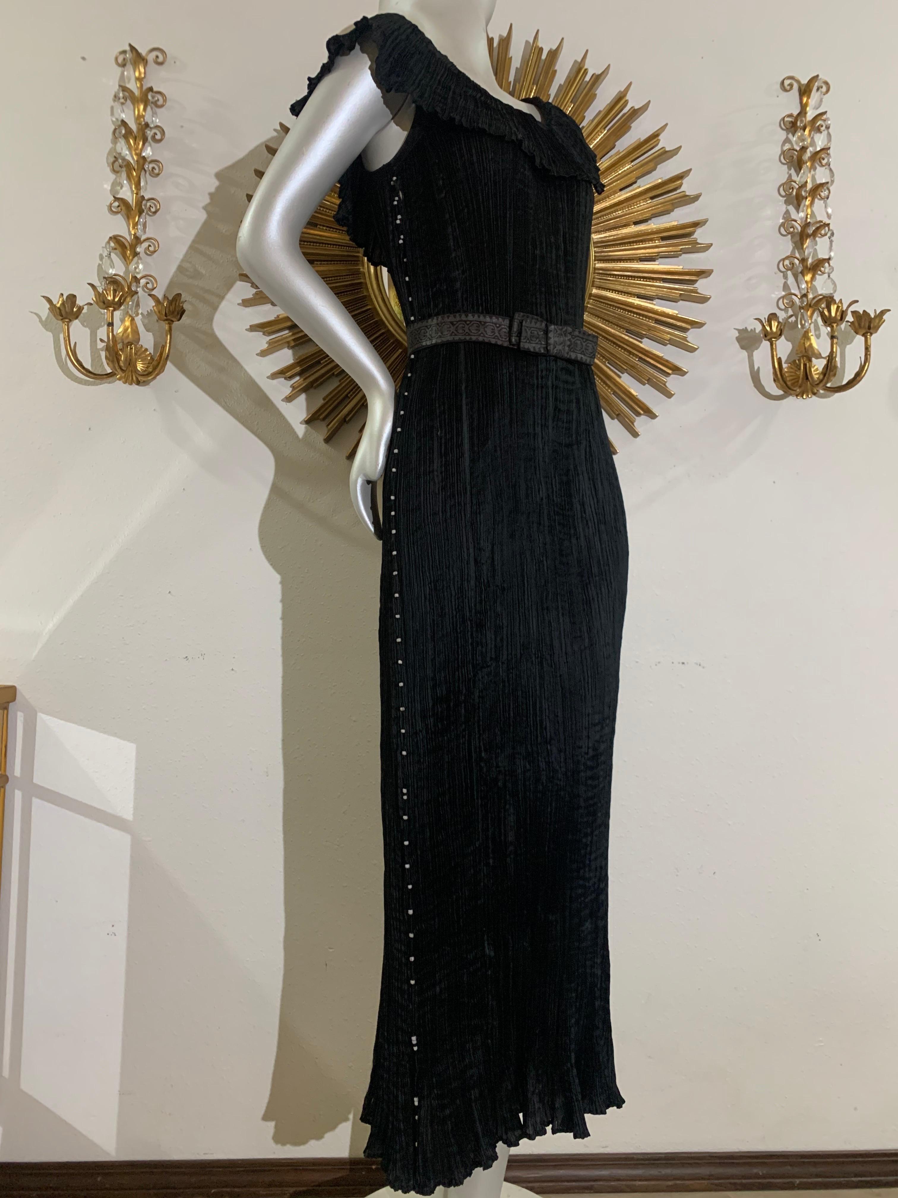 Early 1920s Fortuny Delphos Gown in Black Silk, Murano  Glass Beads & Gold Stenciled Belt. AS FOUND CONDITION with original labels. Absolutely authentic early Mariano Fortuny gown for study, display or photos.  

Fortuny was a Spanish polymath,