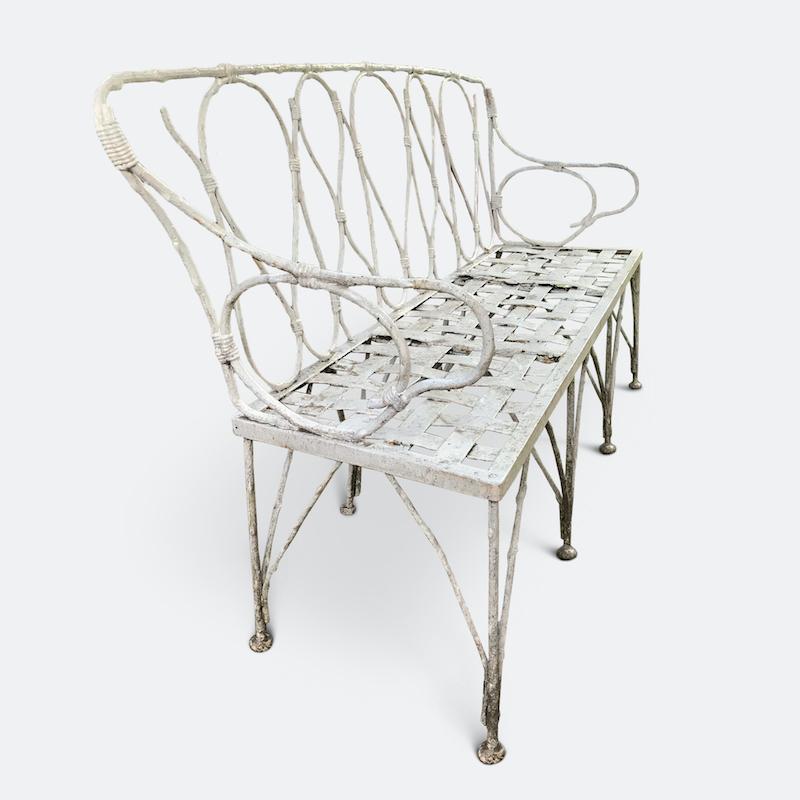 A rare 1920s French faux bamboo garden bench crafted in wrought iron with latticework metal seat. A very beautiful bench.

   