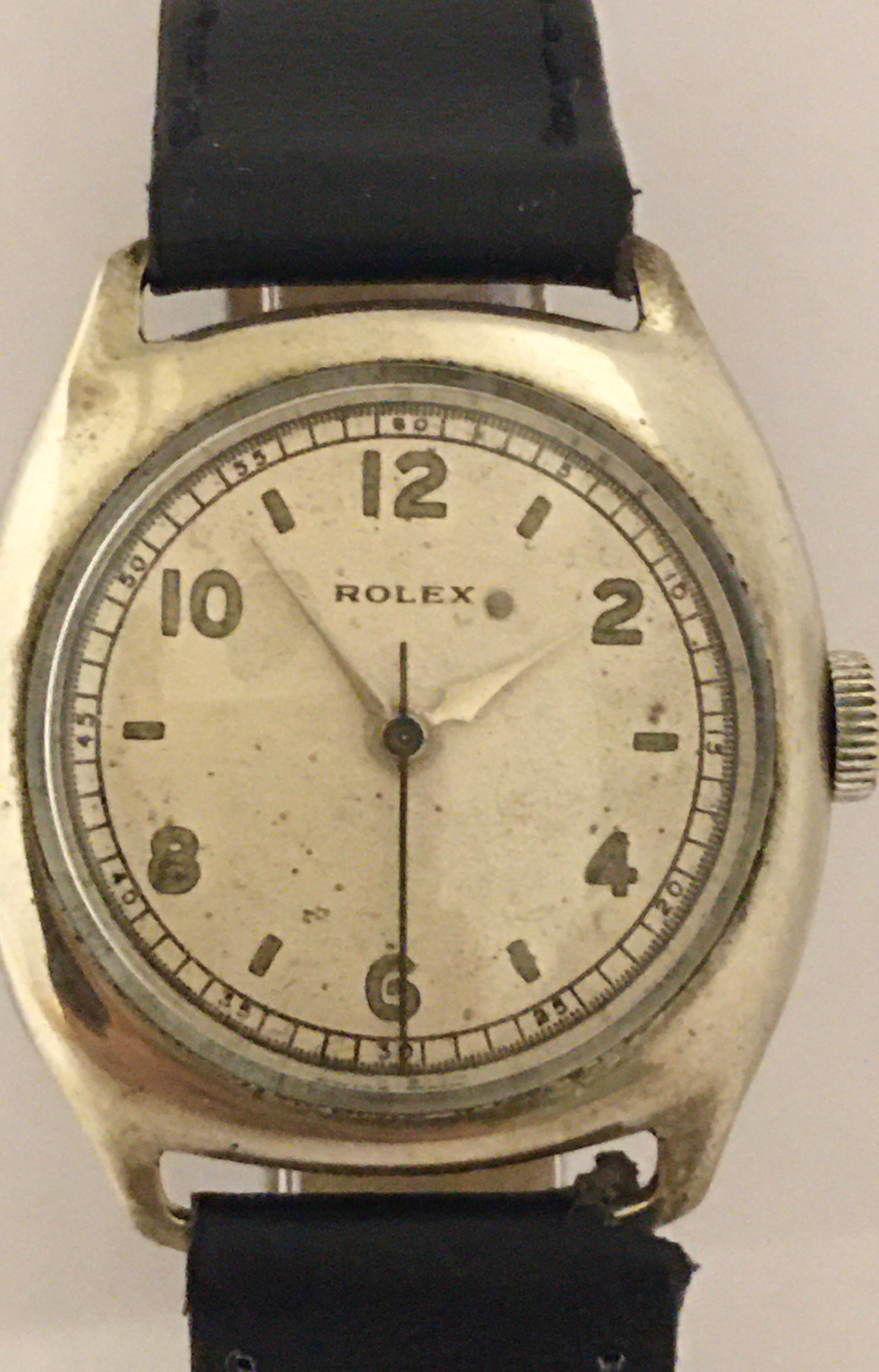 This early and rare Pre-own Manual winding Rolex Watch is working and it is running well. The dial shows signs of used and ageing as shown. The black strap is worn as shown.

Please study the images carefully as form part of the description.