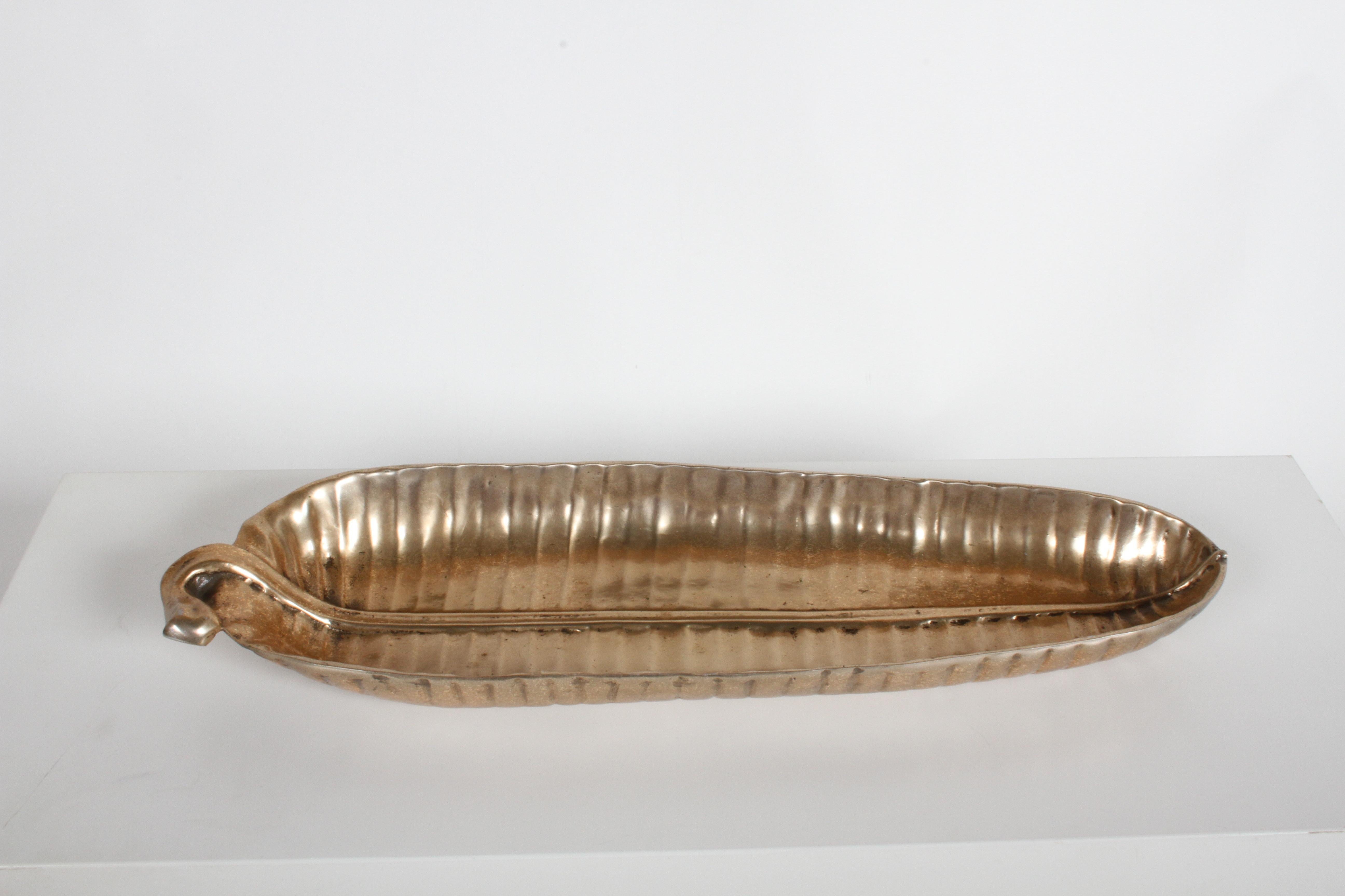 Early 1950s Bruce Fox Designs of a large banana leaf serving bowl, with unusual gold tone over the aluminum. Signed on verso. 

From St. Louis Modernist Architect Meyer Loomstein's estate. 