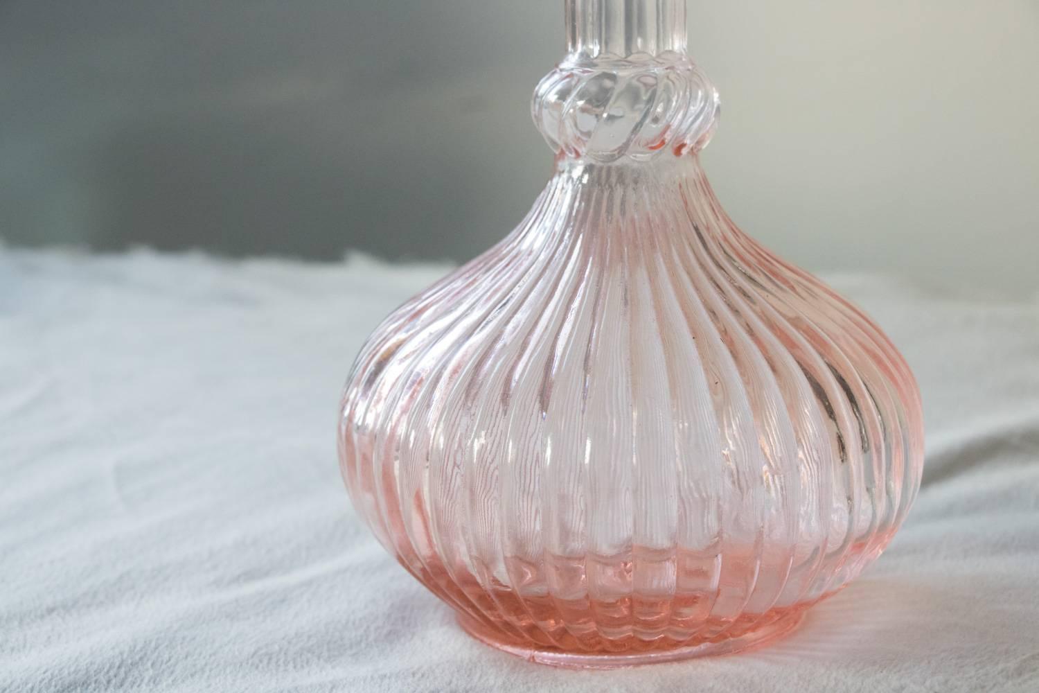 Early 1960s vintage feminine delicate and pretty in pink perfume or liquor decanter. Add a feminine touch to your Barware. A decanter mimics the effects of swirling the wine glass causing the oxidation processes. This triggers the release of