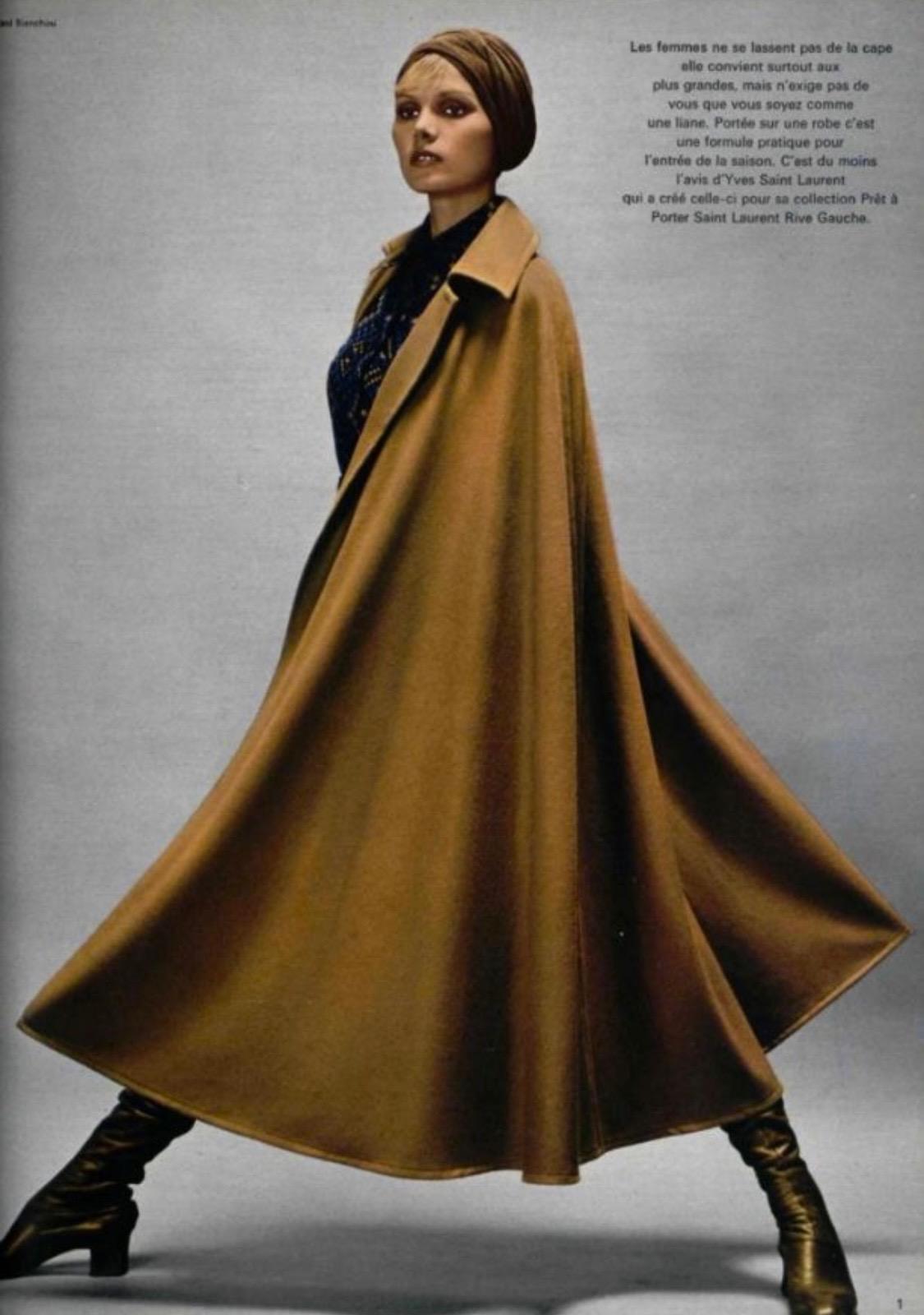 Presenting a beautiful camel wool Saint Laurent Rive Gauche poncho. Designed by Yves Saint Laurent in the 1970s for his first ready-to-wear line, Saint Laurent Rive Gauche. The introduction of YSL's new line was a radical shift in the fashion