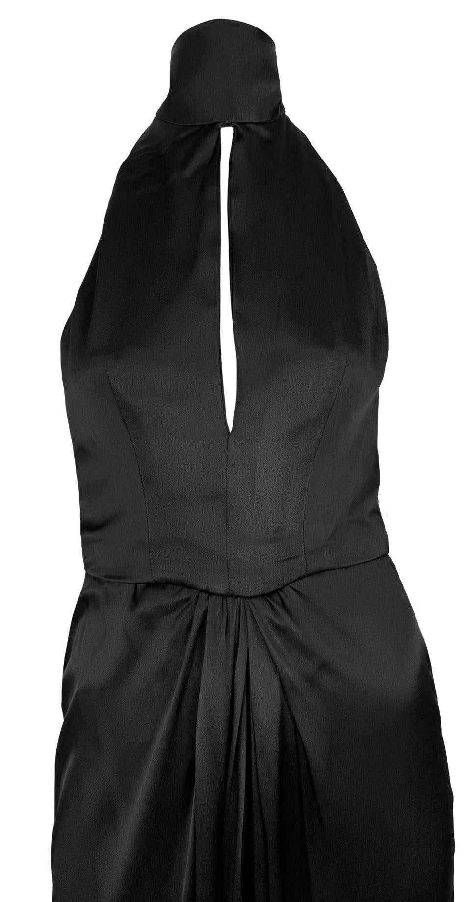 This early 1980s Bob Mackie black satin evening gown features a backless halter tie design, a keyhole neckline, and draped waist detailing.

Approximate measurements:
Size - removed
Bust: 32