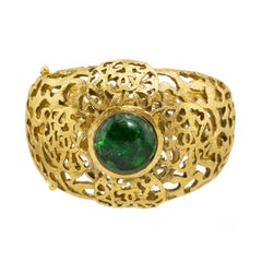 Chanel Gold Tone Filigree Cuff With Emerald Green Poured Glass Stone, Early 1980