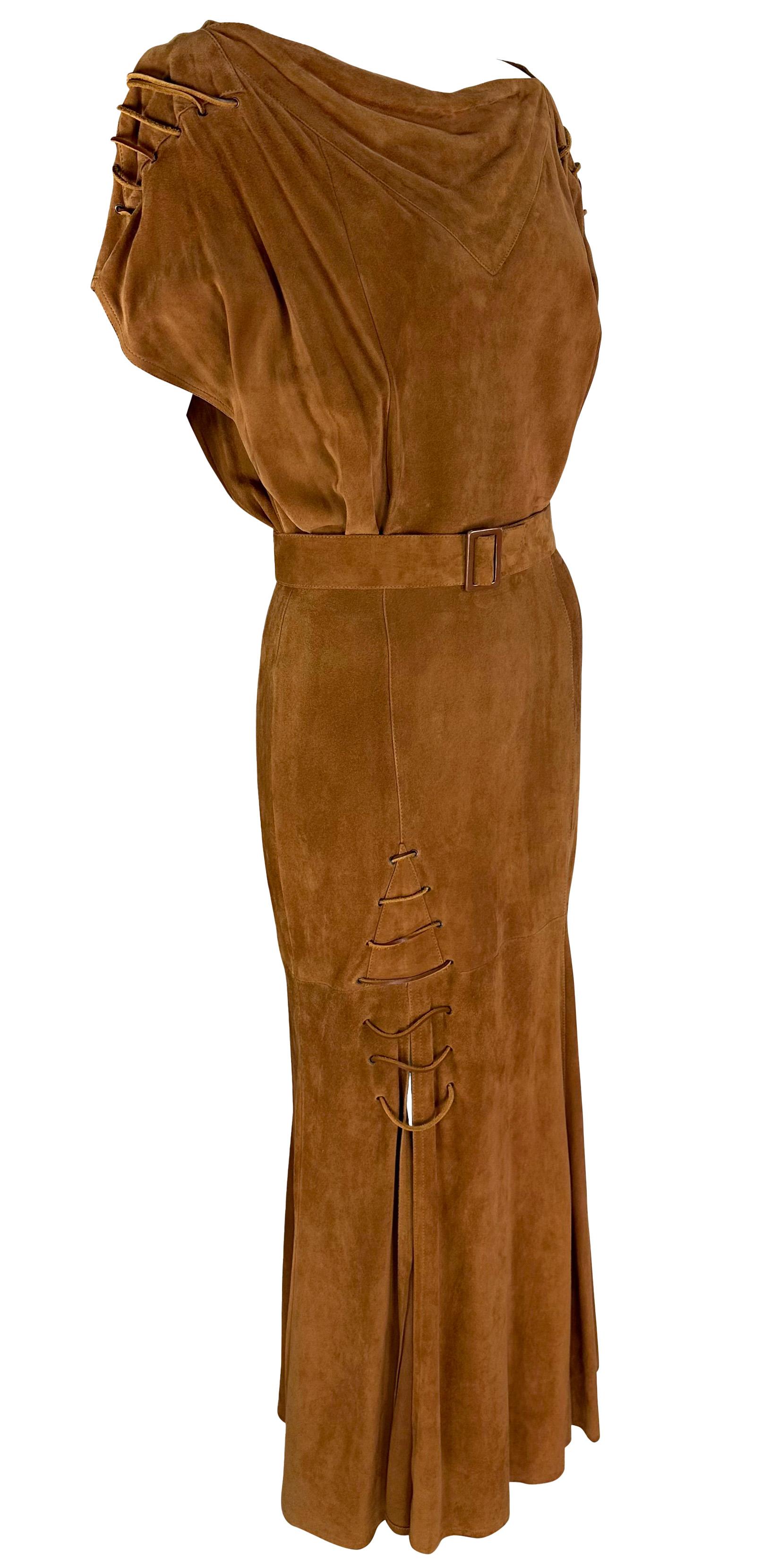 This brown maxi dress by Thierry Mugler, from the early 1980s, is made entirely of soft suede. It has a draped neckline and petal sleeves. Leather lace-up details appear at the shoulders and along the front slit, adding texture and visual interest.