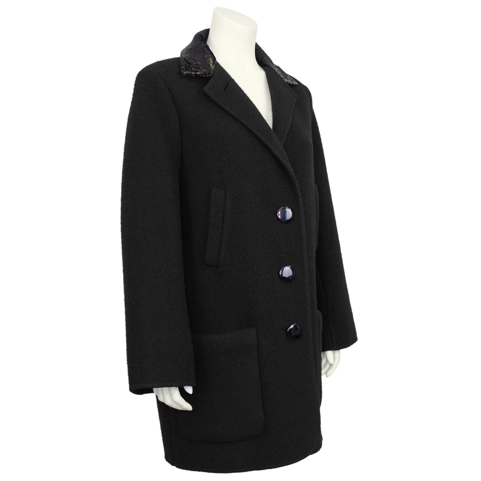 Simply elegant early 1990's Geoffrey Beene single breasted black wool 3/4 length car coat with black tinsel collar and dramatic oversized black buttons. Notched collar and straight reefer style silhouette enhanced with two angled pockets and two
