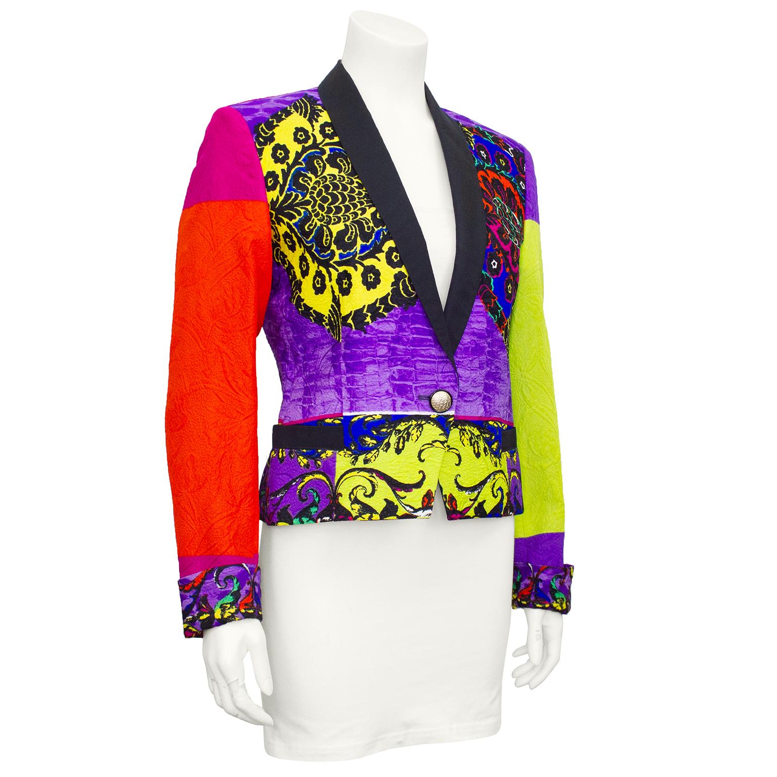 Colourful tuxedo style jacket from Gianni Versace's early 1990's collections. Lime green, purple, yellow, pink and orange colour block brocade with classic Versace Baroque print throughout. Subtle metallic throughout brocade. Black satin label with